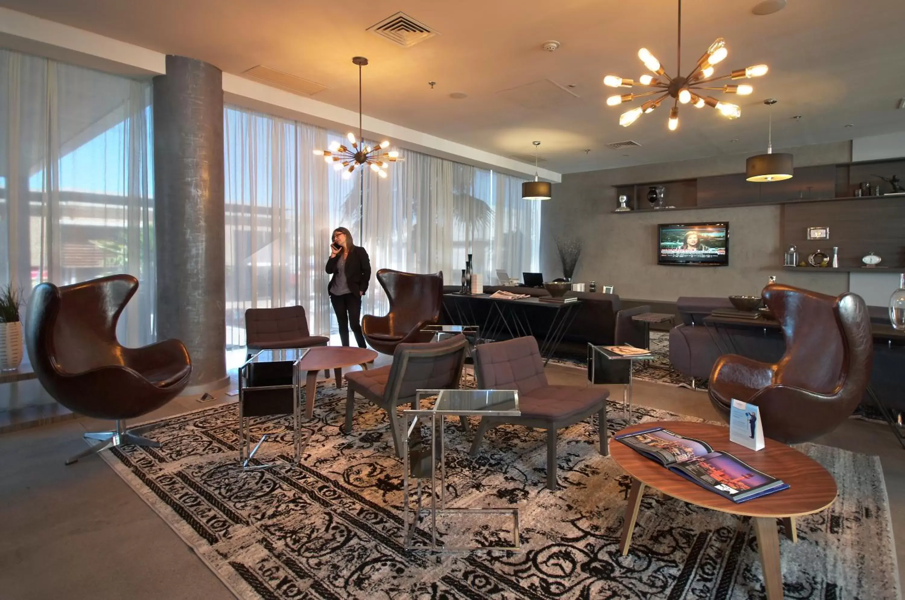 Communal lounge/ TV room in Ramada Encore by Wyndham Chihuahua Distrito 1