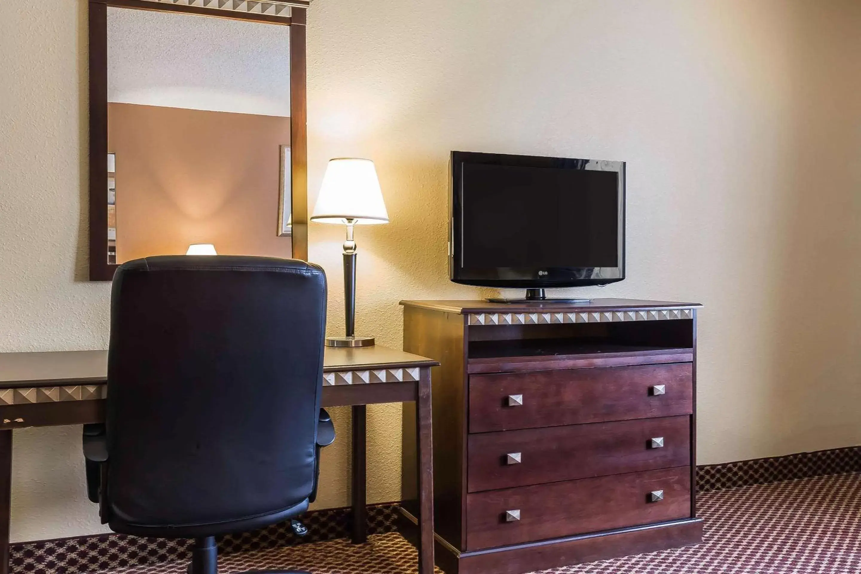 Photo of the whole room, TV/Entertainment Center in Quality Inn & Suites Bloomington University Area