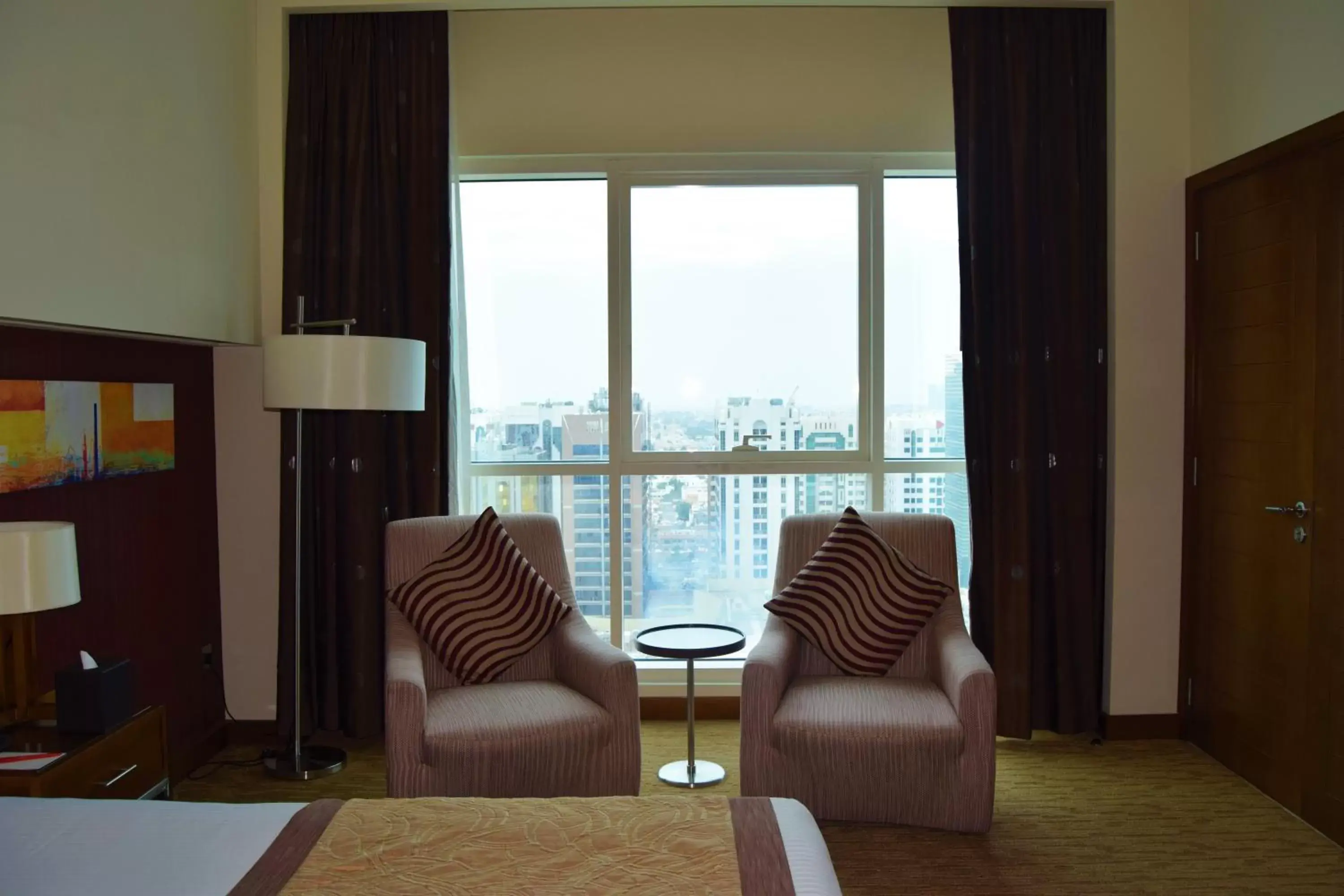 City view, Seating Area in Grand Millennium Al Wahda Hotel and Executive Apartments Abu Dhabi