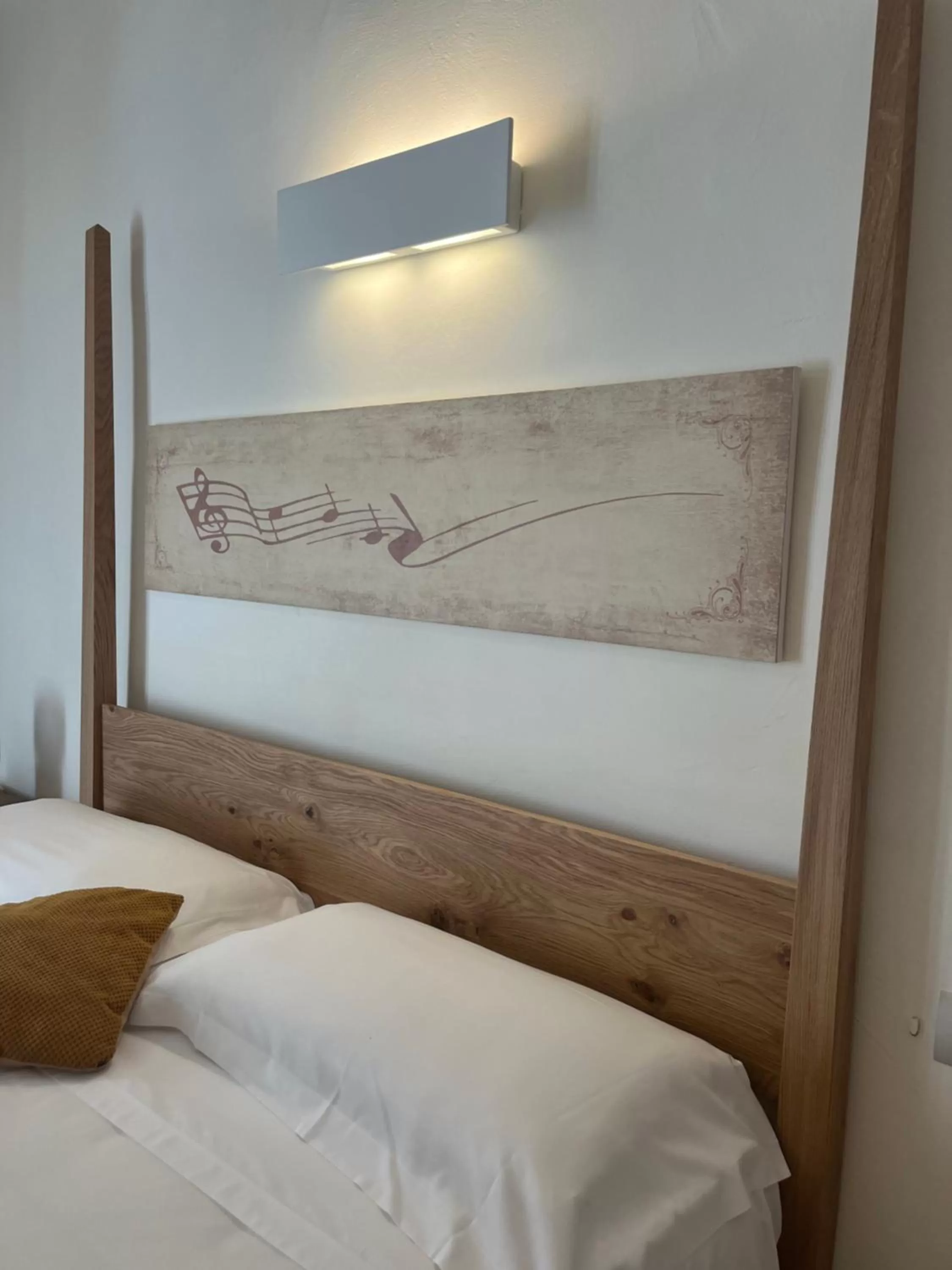 Bed in Antico Mondo Rooms & Suites