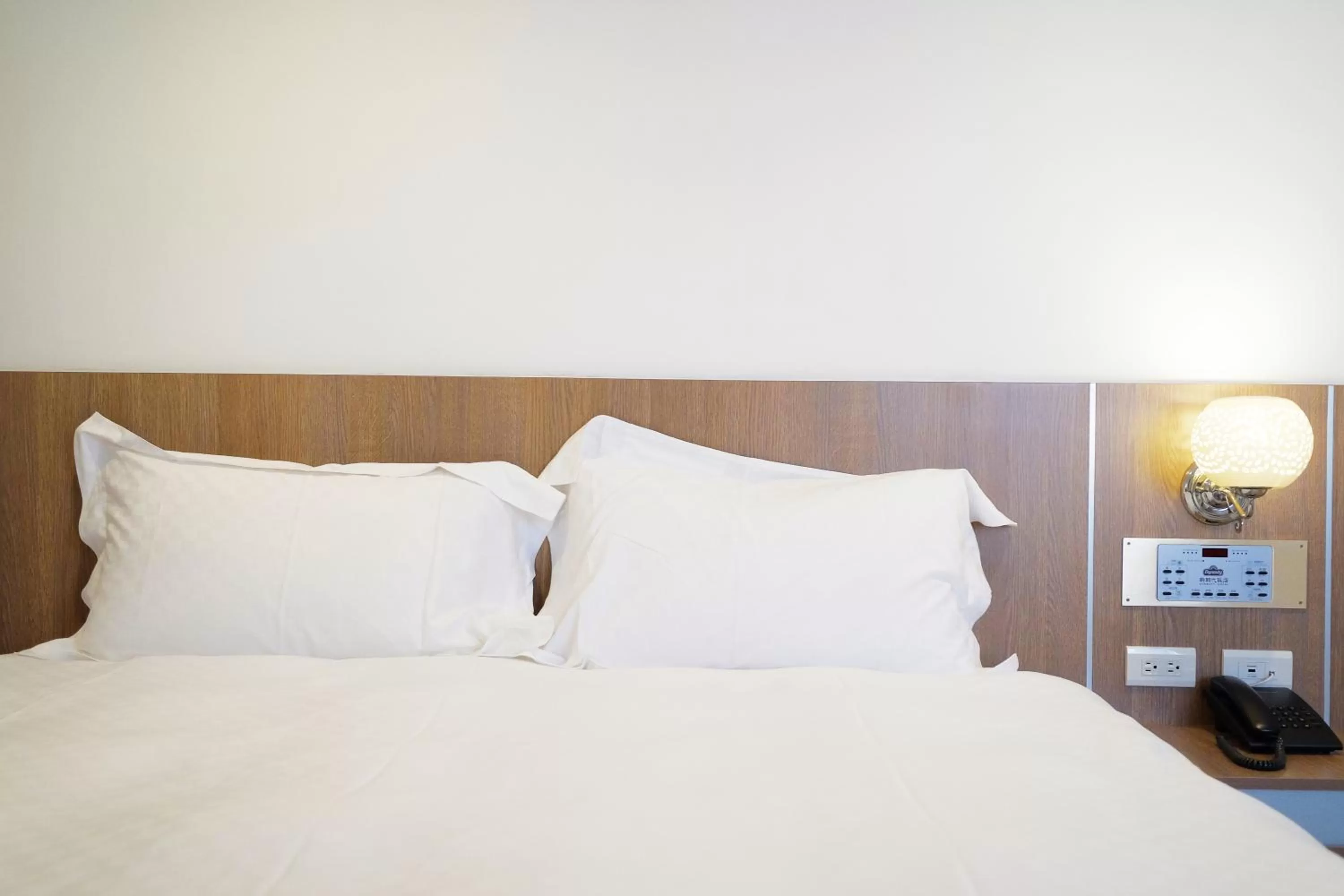 Bed in Dynasty Hotel