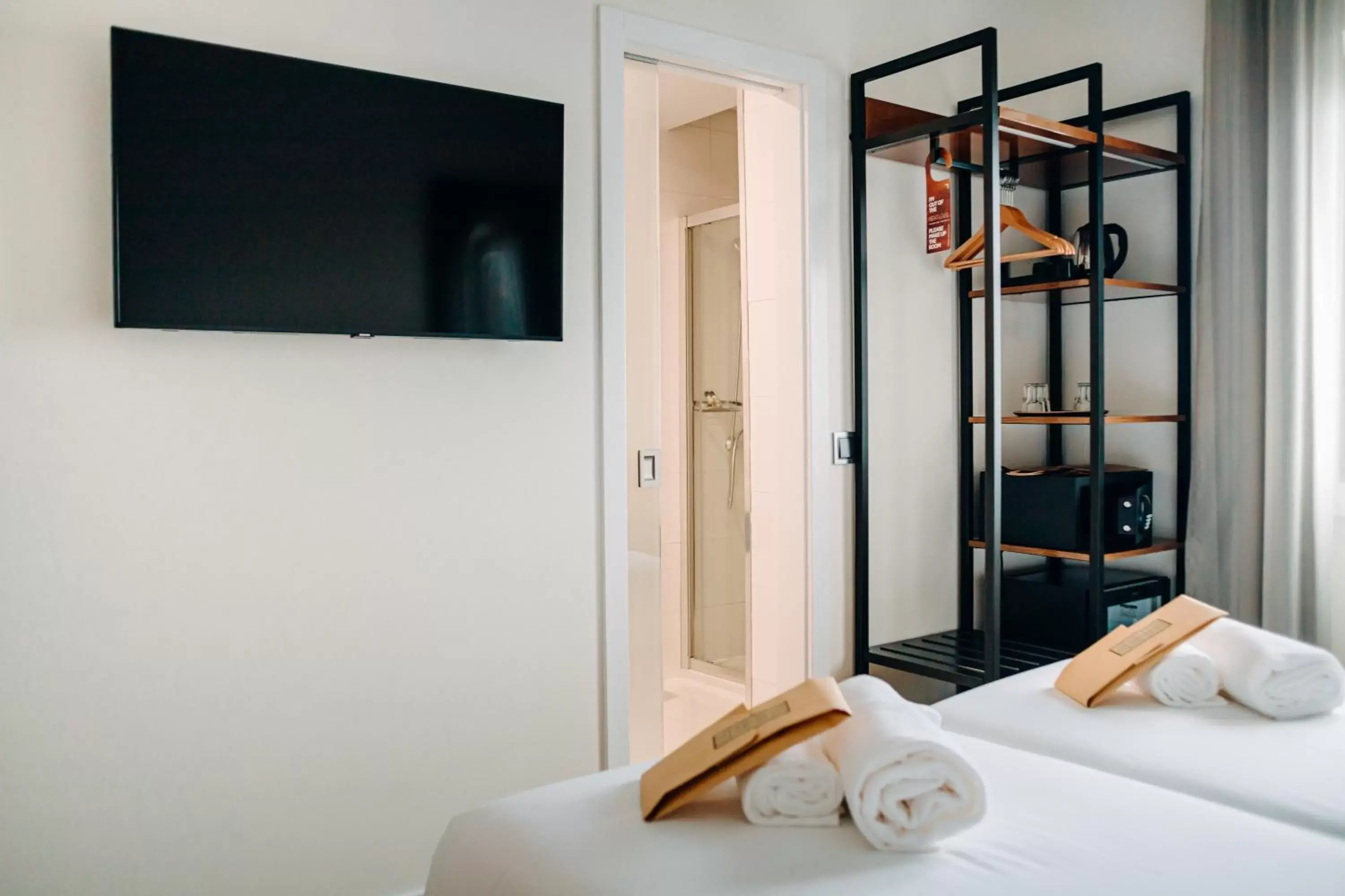 Bedroom, TV/Entertainment Center in Next Level Premium Hotels
