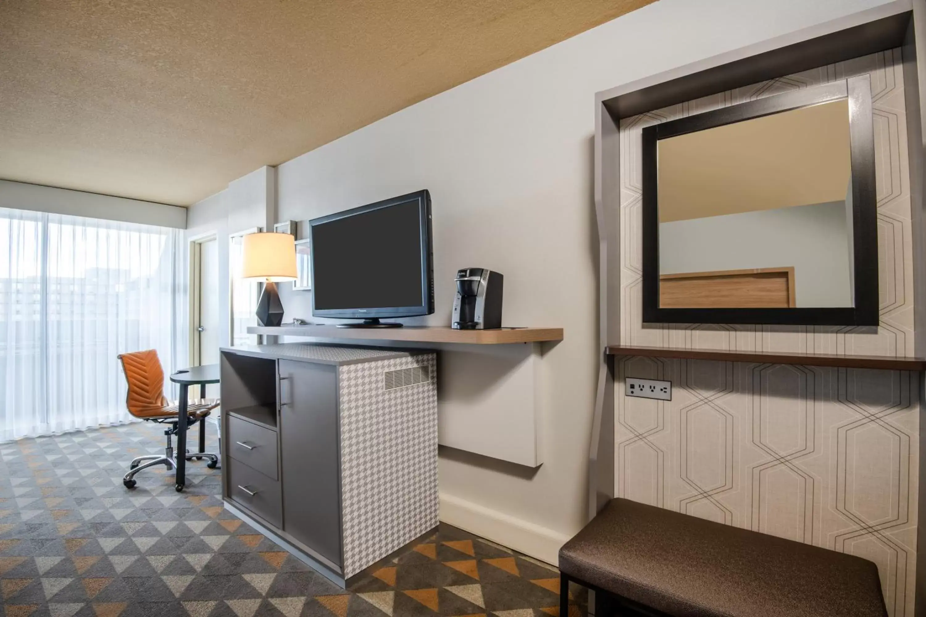 Photo of the whole room, TV/Entertainment Center in Holiday Inn Denver East, an IHG Hotel