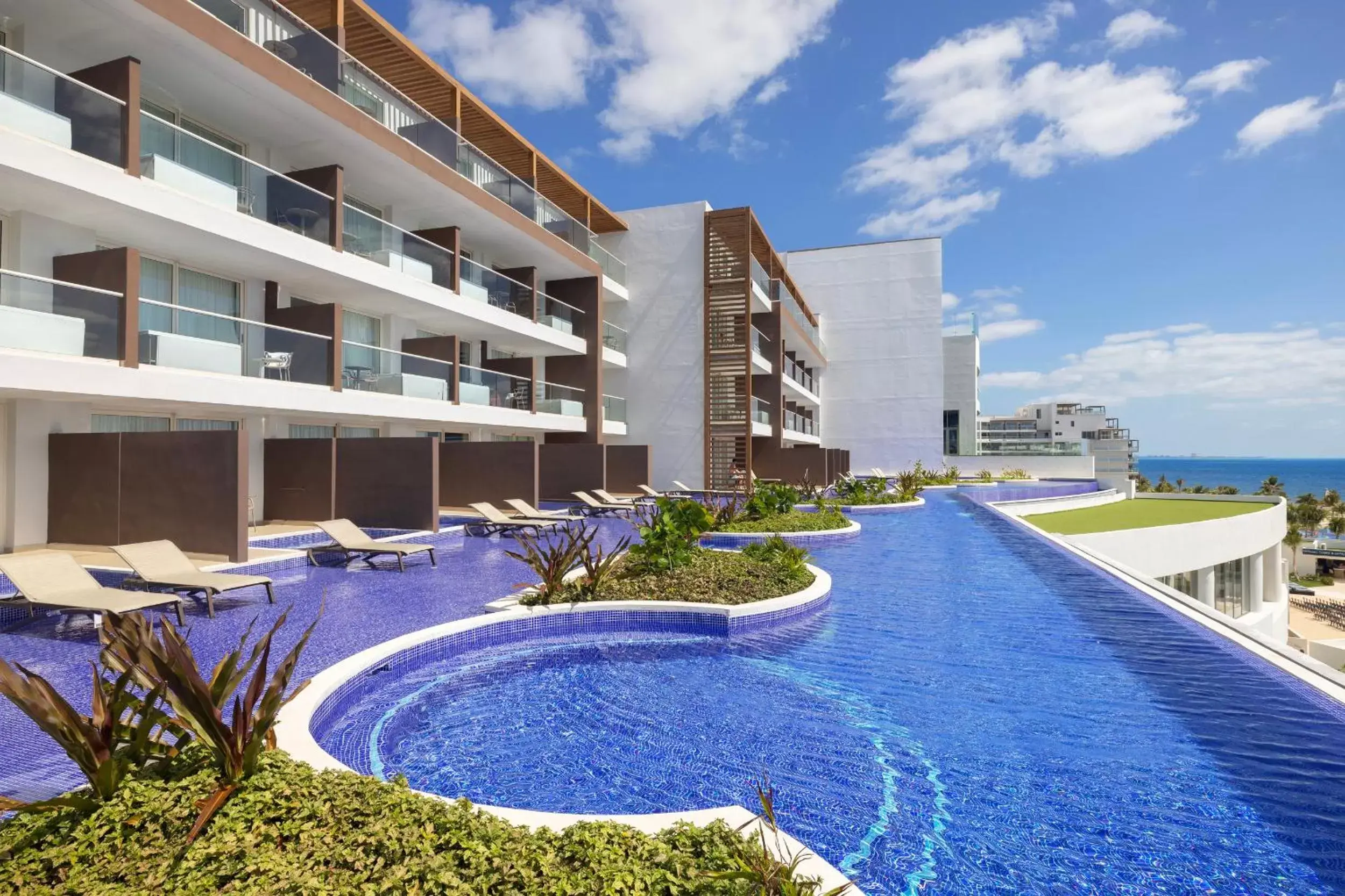 Property building, Swimming Pool in Royalton Splash Riviera Cancun, An Autograph Collection All-Inclusive Resort