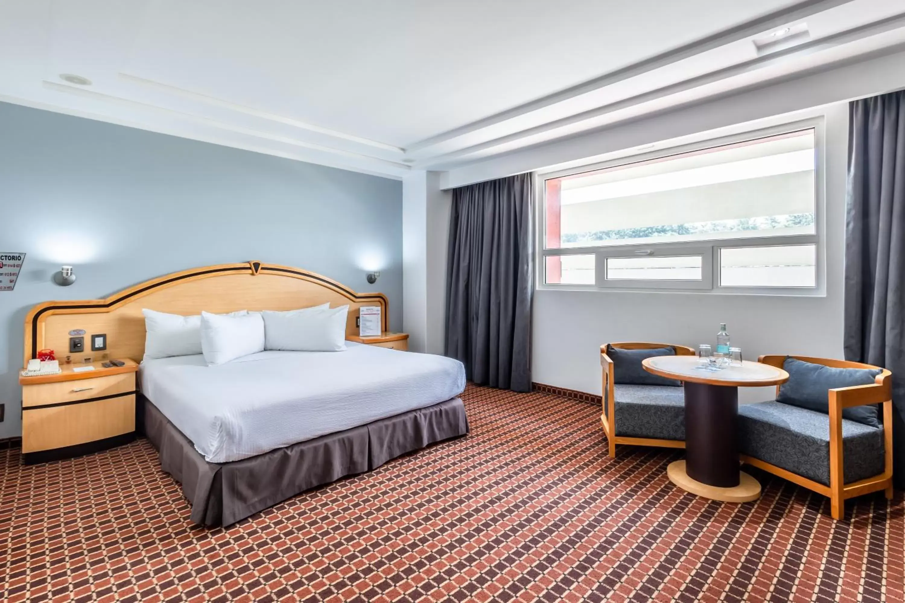 Bedroom in Suites Inn la Muralla Hotel & Spa