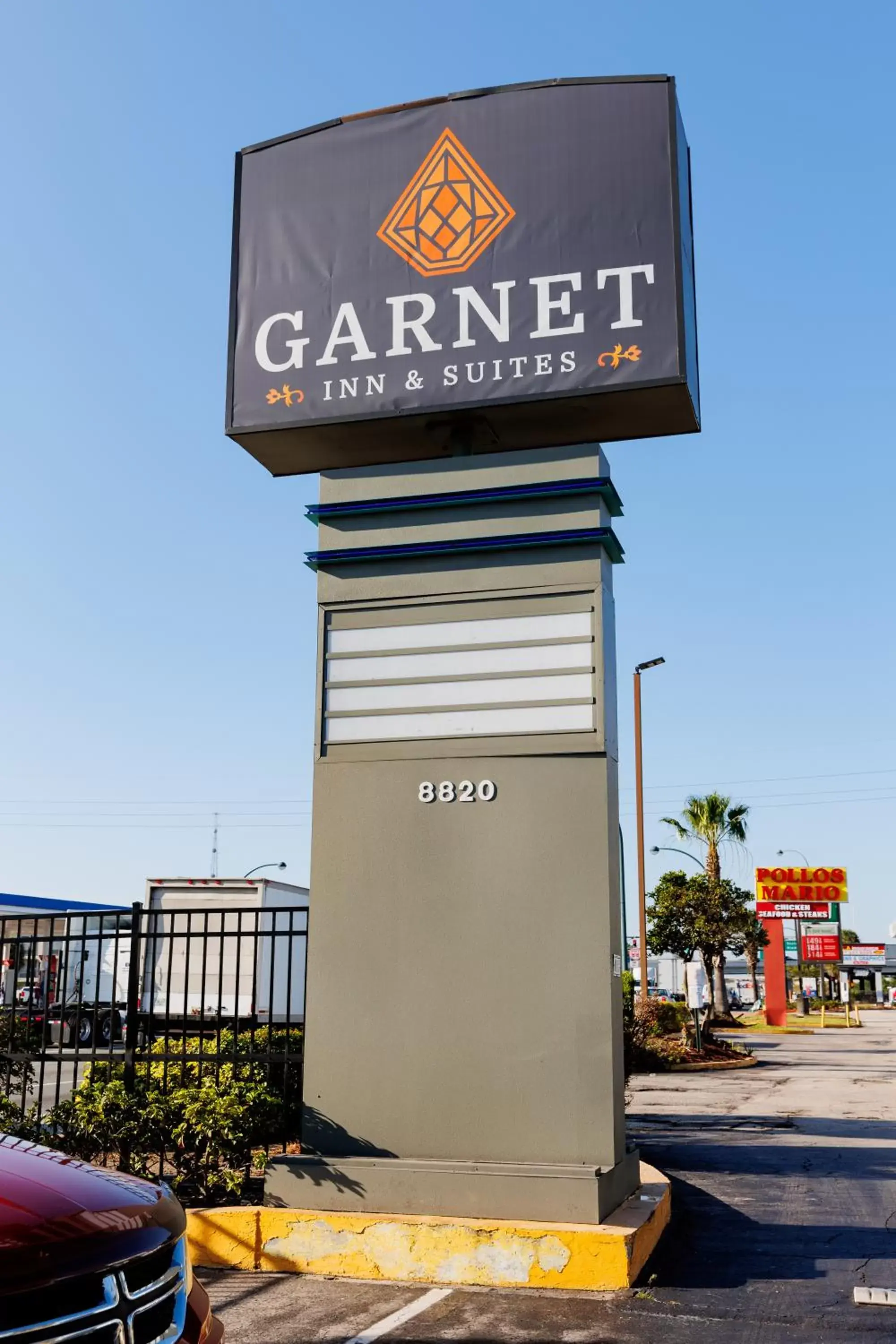 Property logo or sign in Garnet Inn & Suites, Orlando