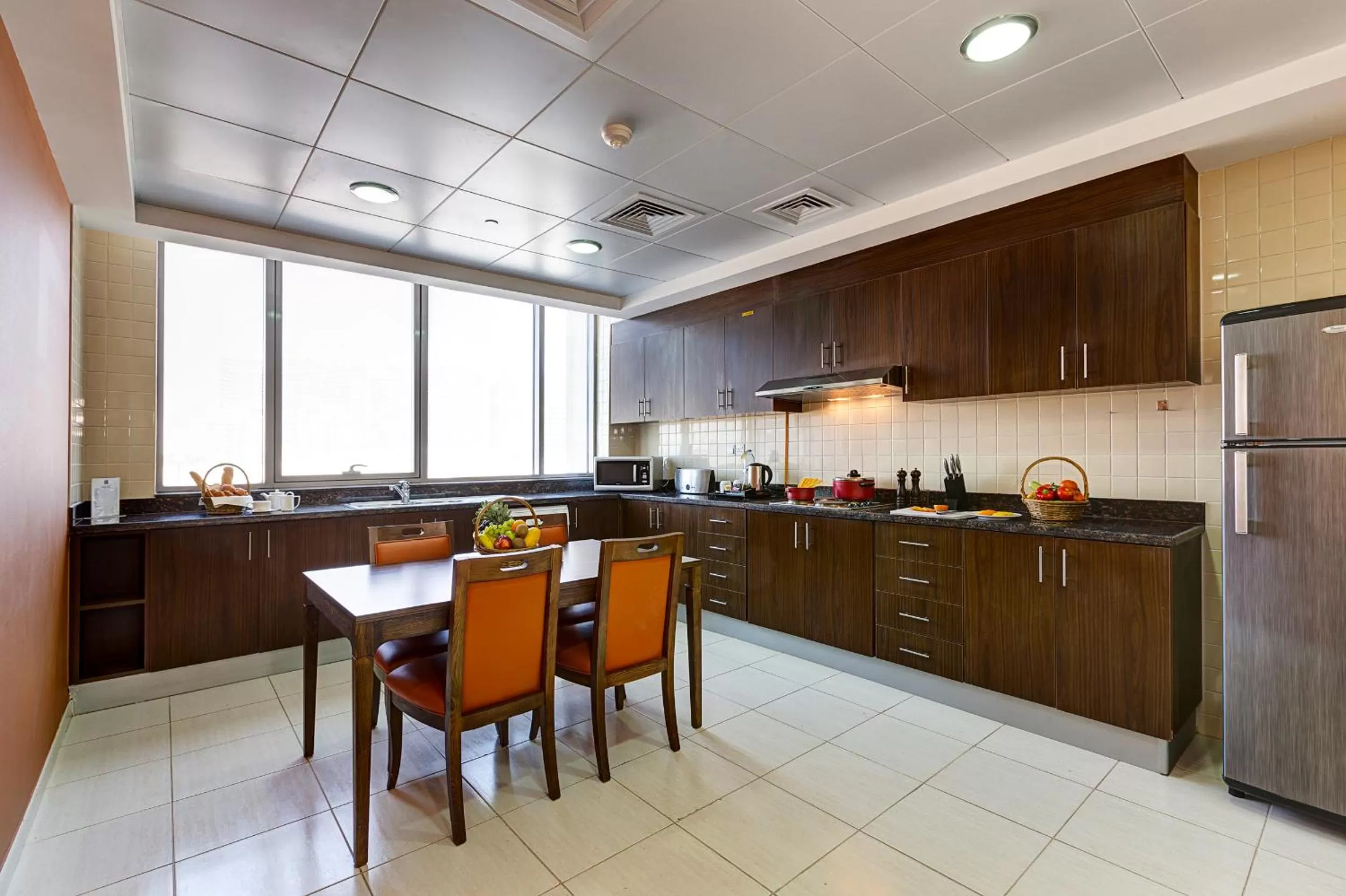 Kitchen or kitchenette in Abidos Hotel Apartment Dubai Land