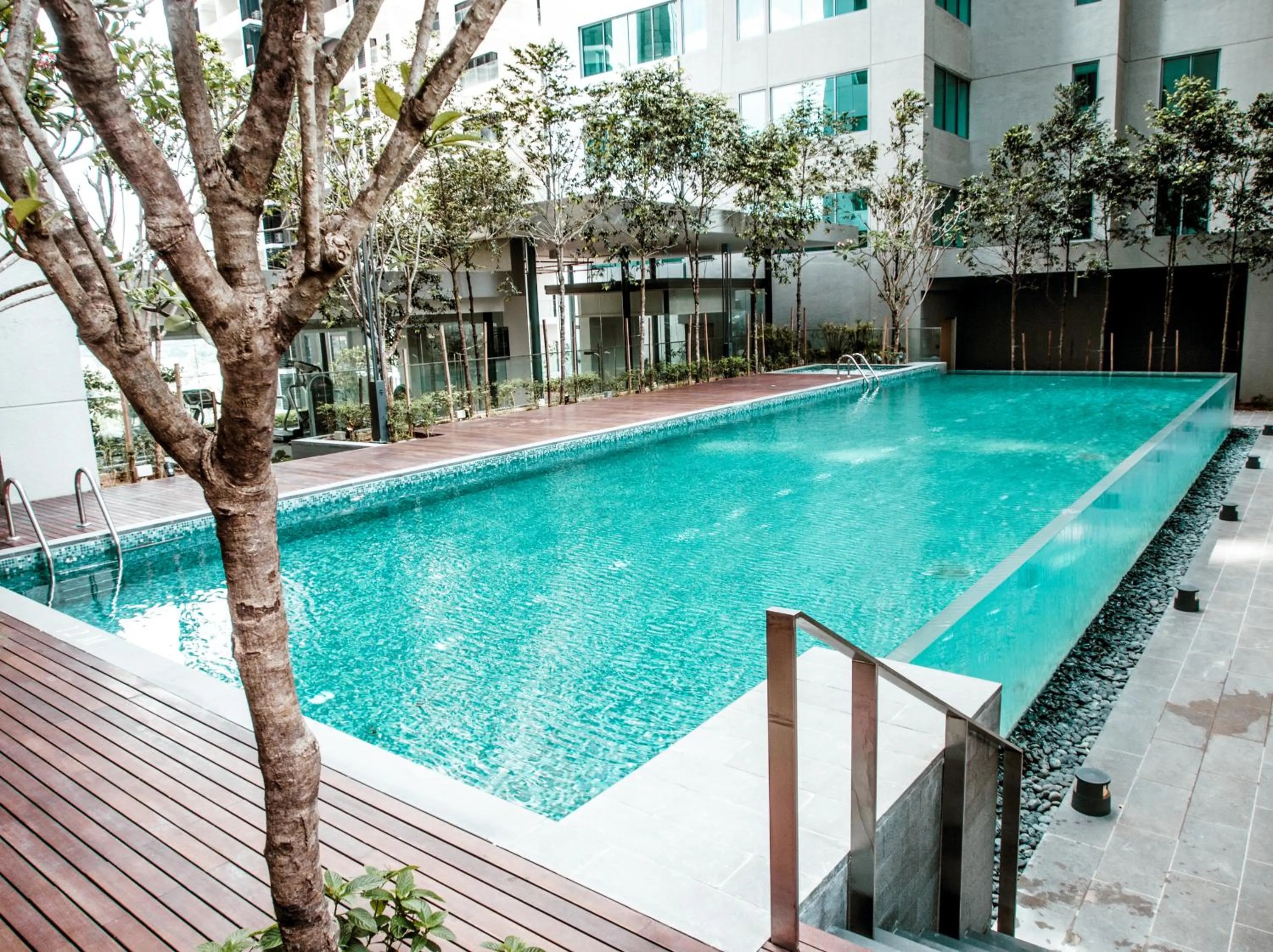 Swimming pool in Summer Suites Residences by Subhome