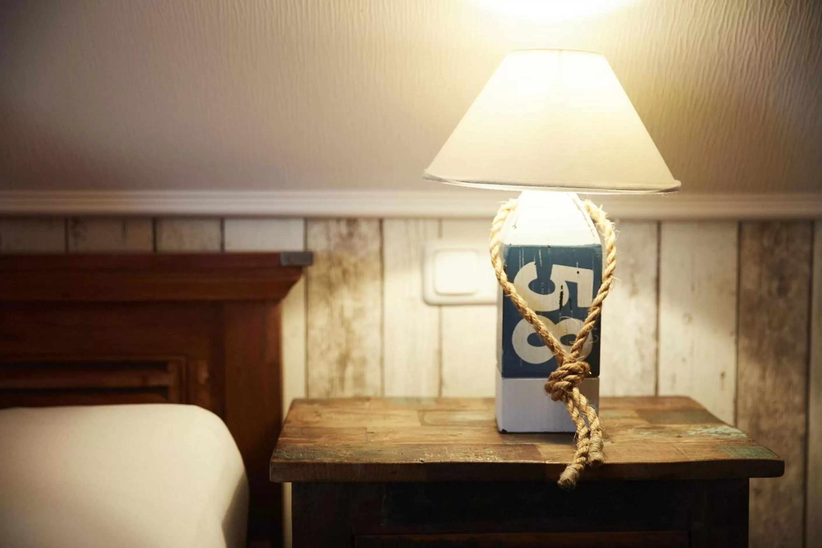 Decorative detail, Bed in Bernstein-Hotel Bootshaus