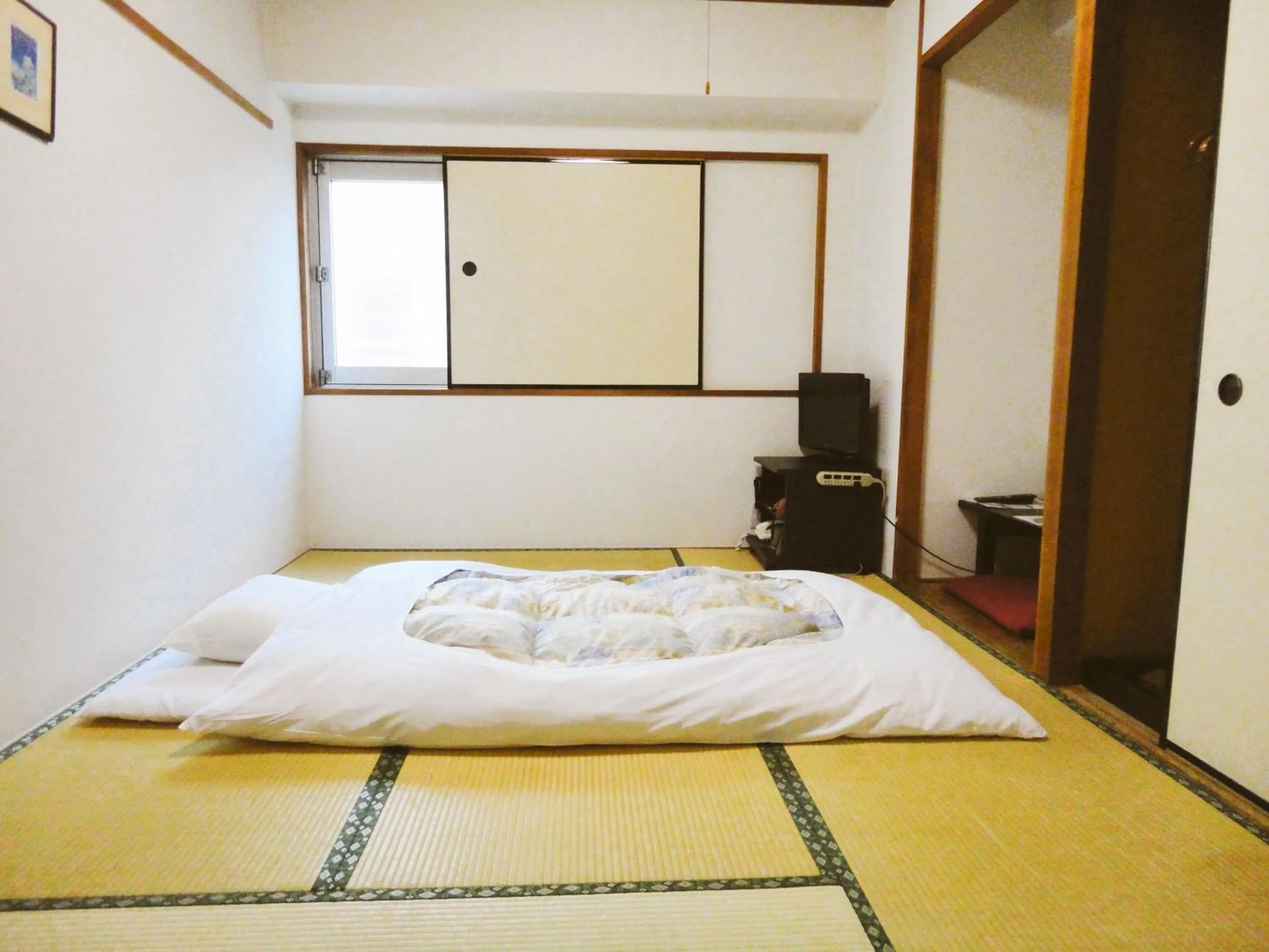 Bed in Hotel Marutani