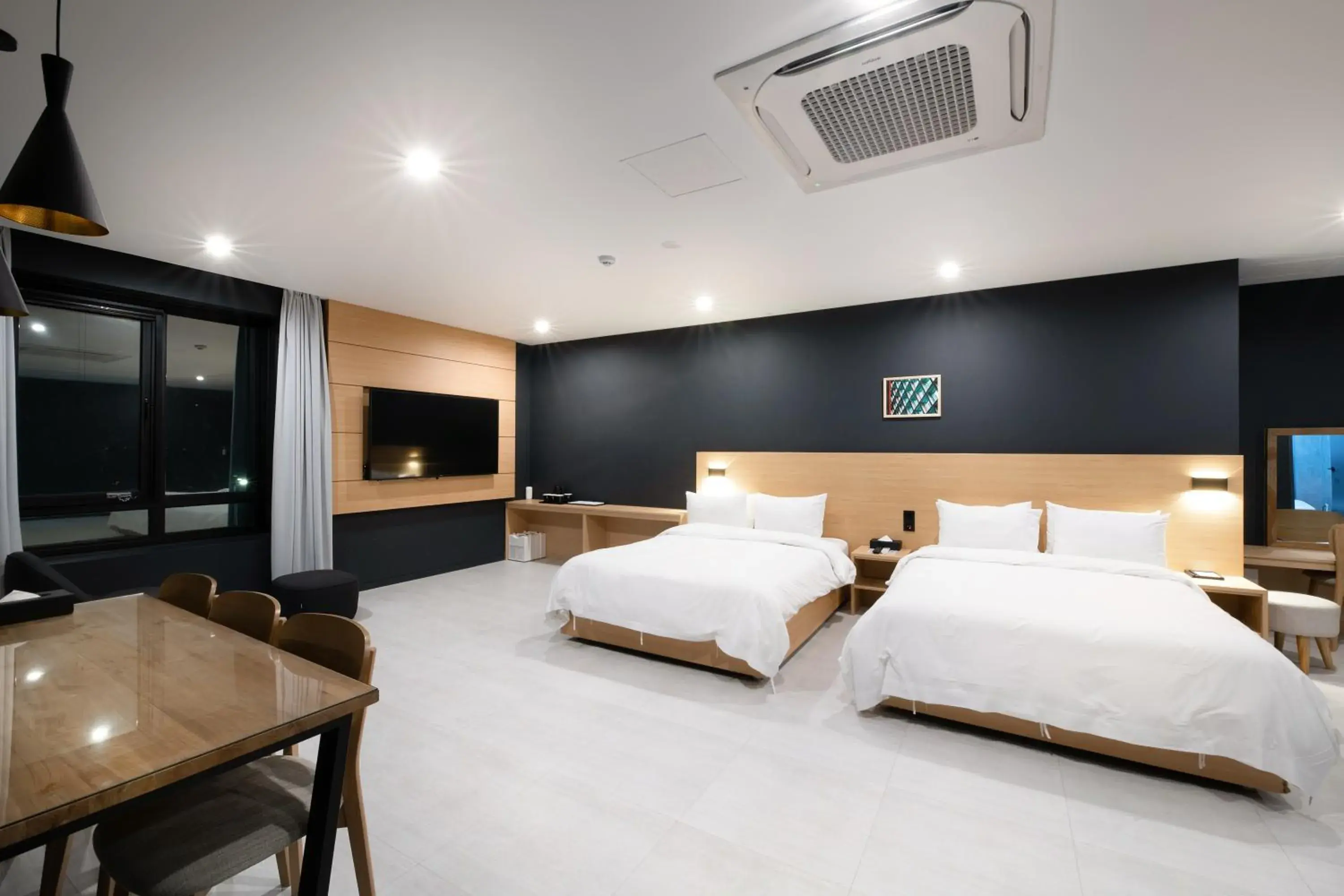 Bed in Mipo Oceanside Hotel