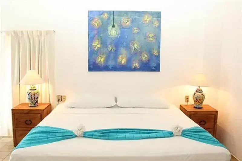 Bed in Emperador Vallarta Beachfront Hotel and Suites