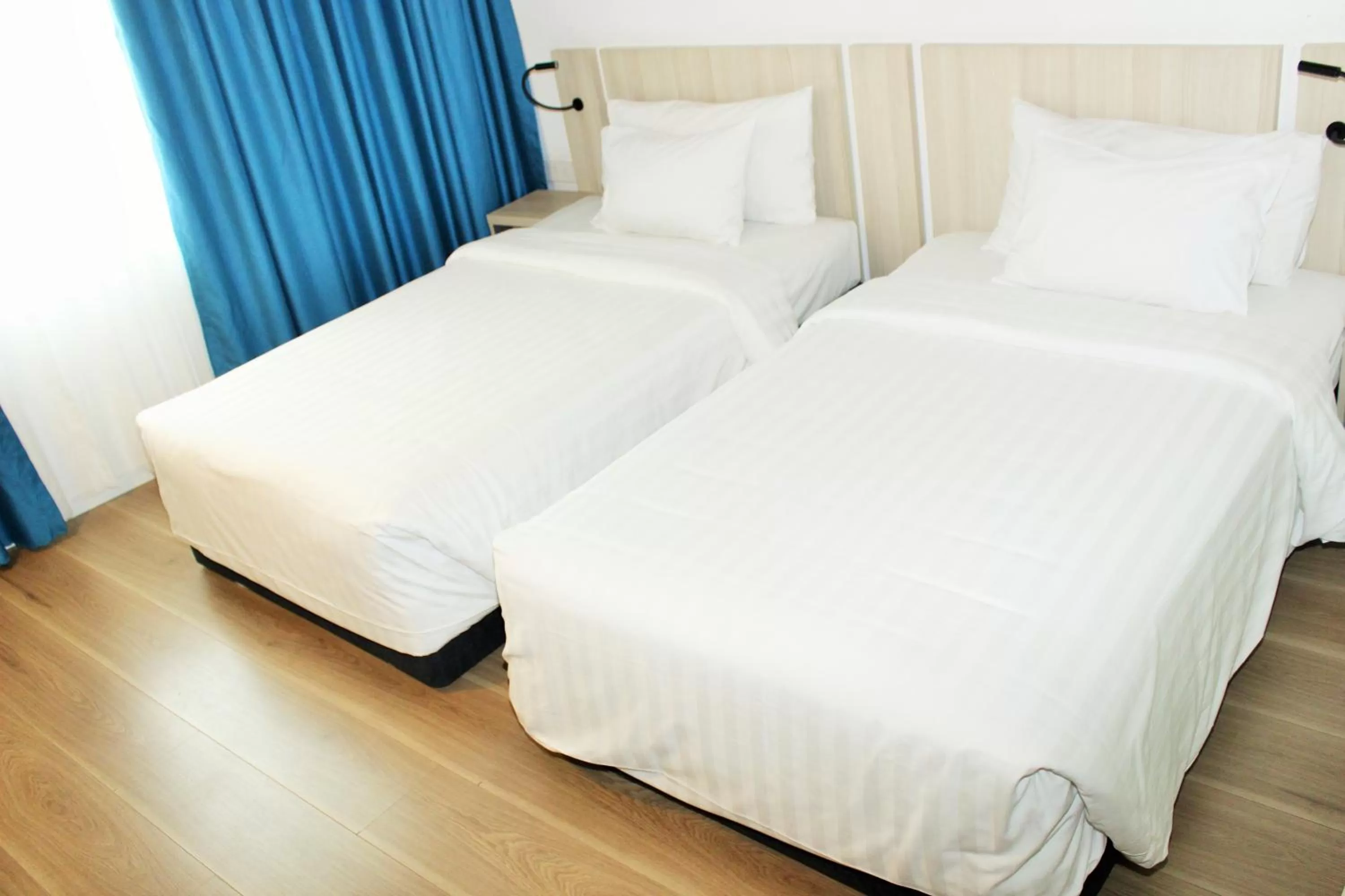 Bed in Liberty Hotel Saigon Greenview