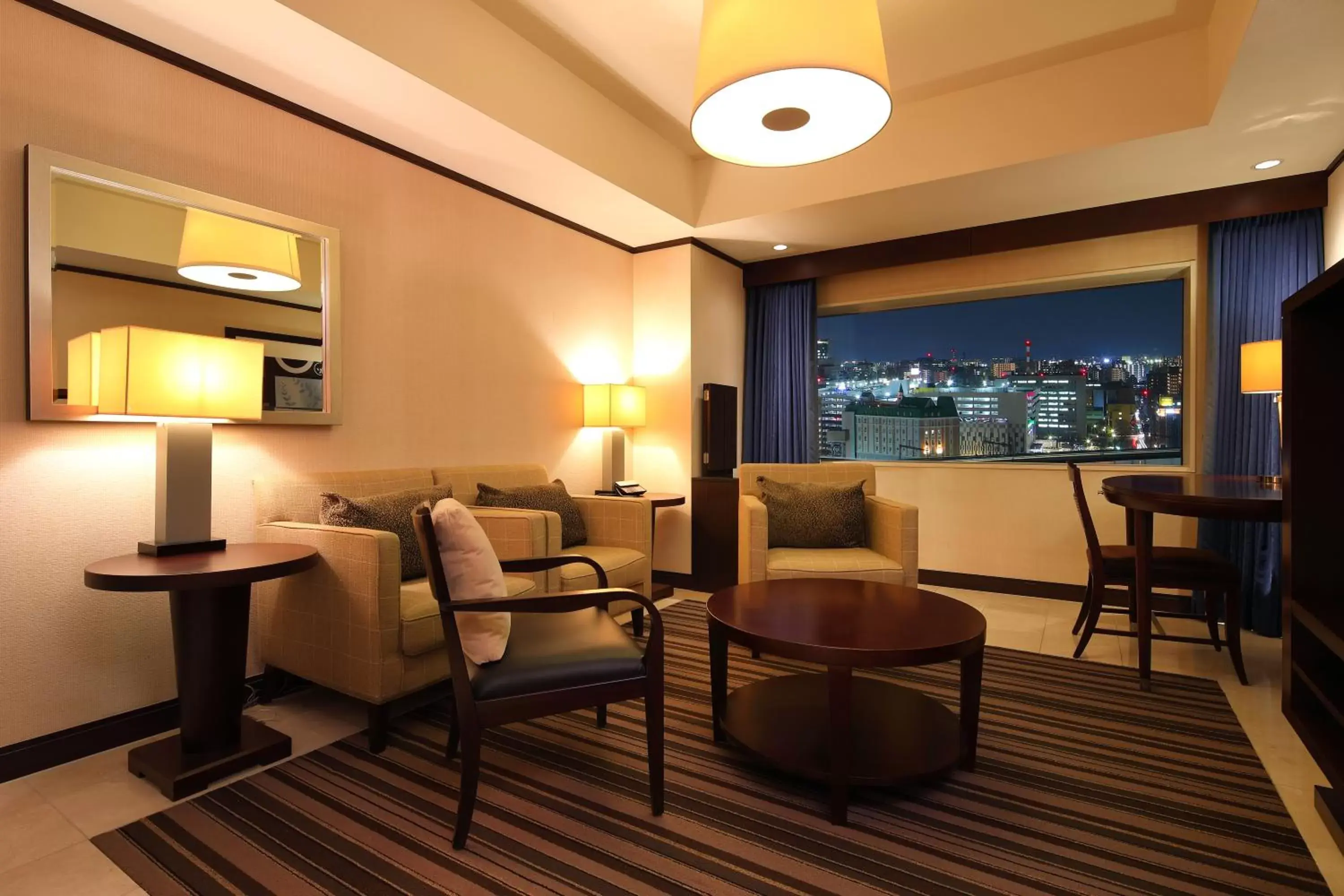 Living room in ANA Crowne Plaza Okayama by IHG Living room in ANA Crowne Plaza Okayama by IHG