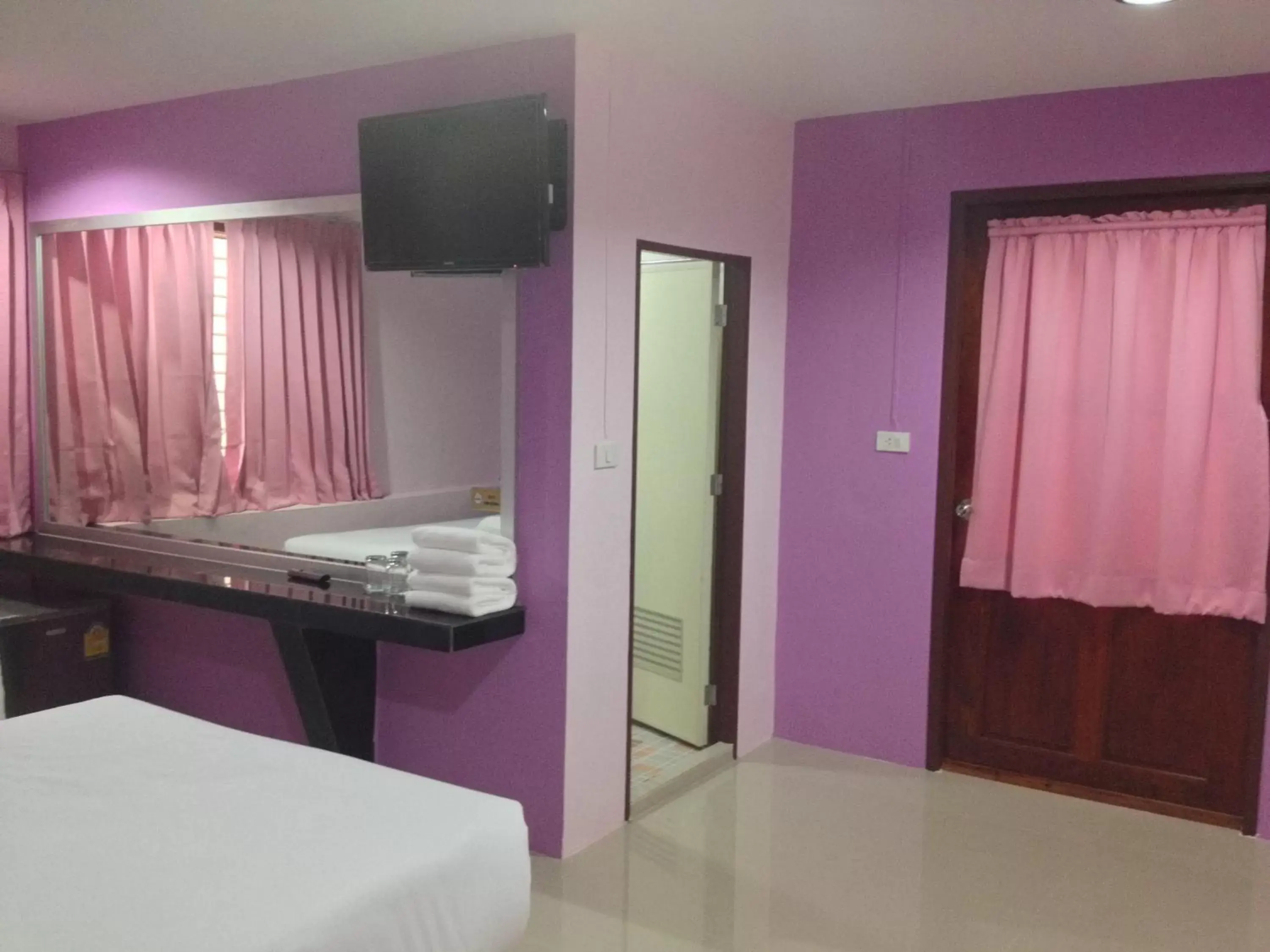 Bedroom, TV/Entertainment Center in Krabi Orchid Hometel
