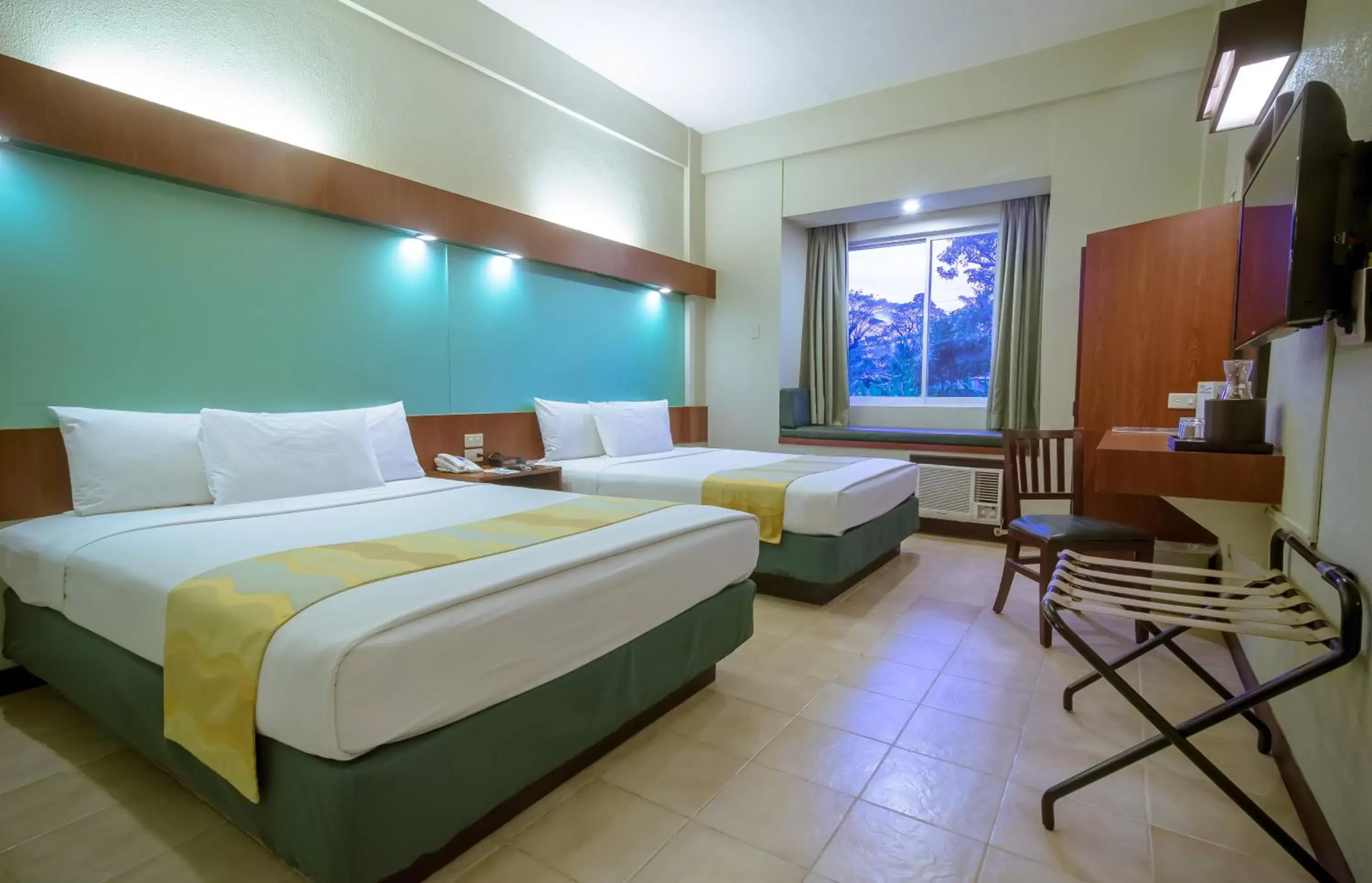 Bed in Microtel by Wyndham Tarlac