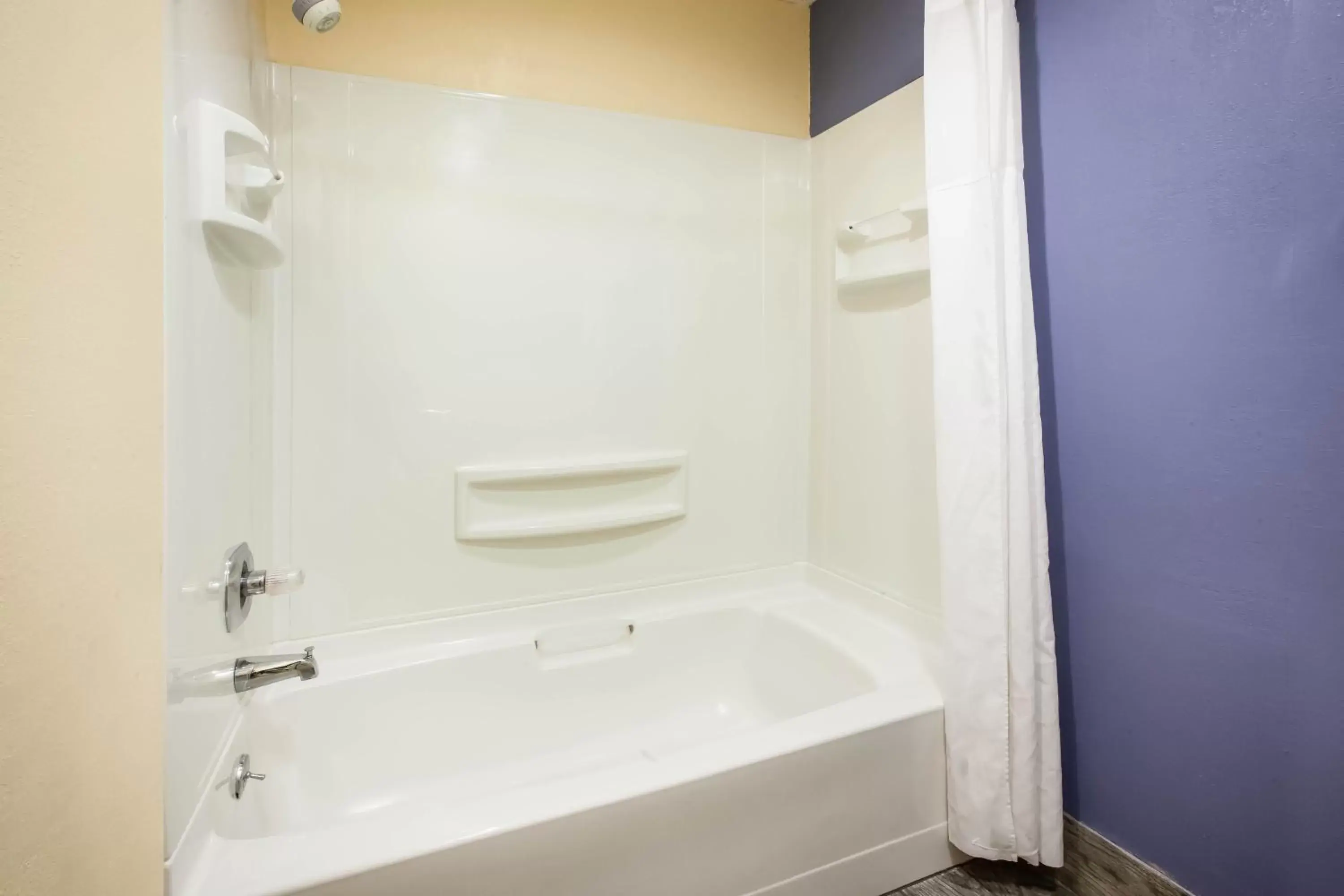 Bathroom in Days Inn by Wyndham Cadillac