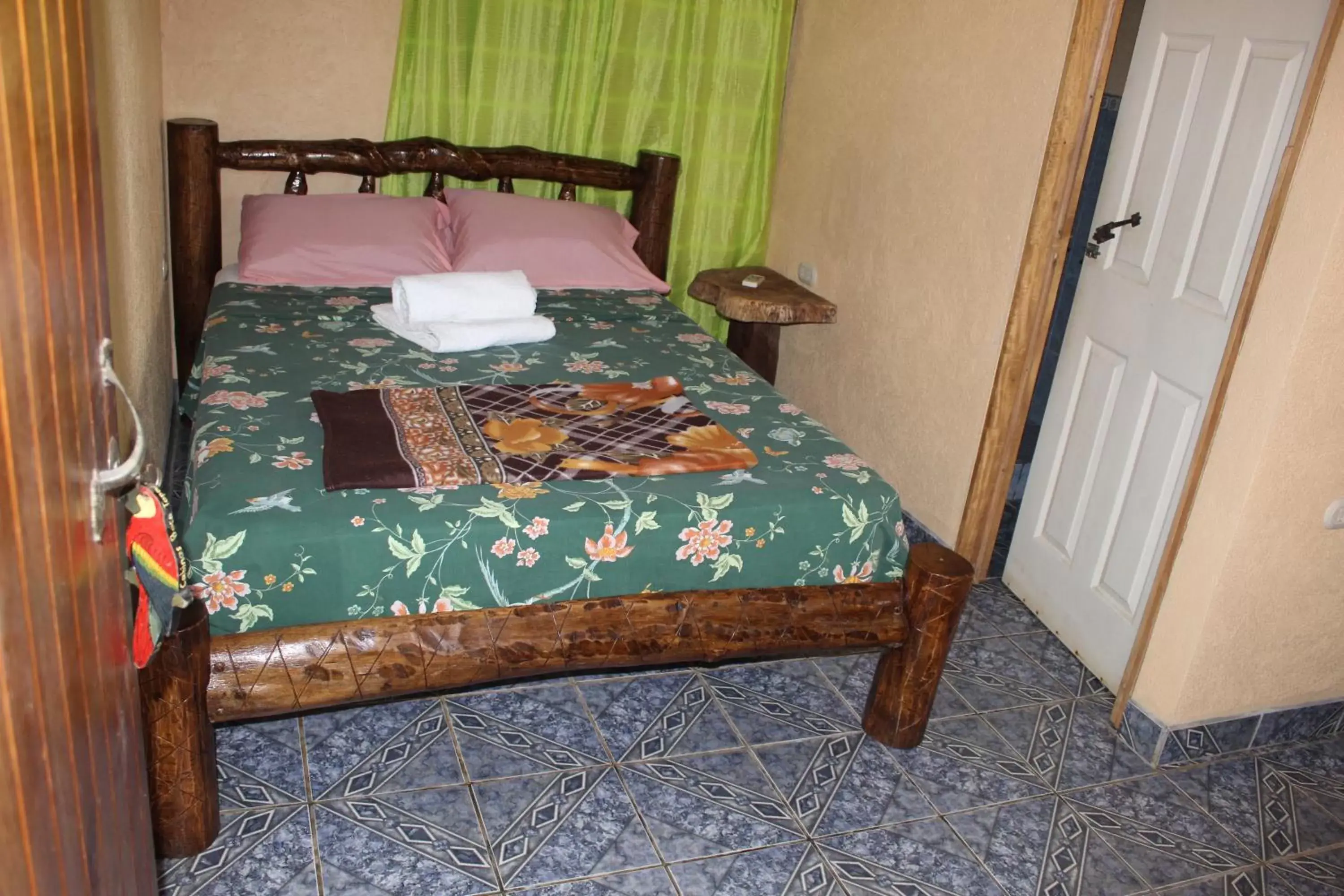 Bed in Iguanitas Lodge