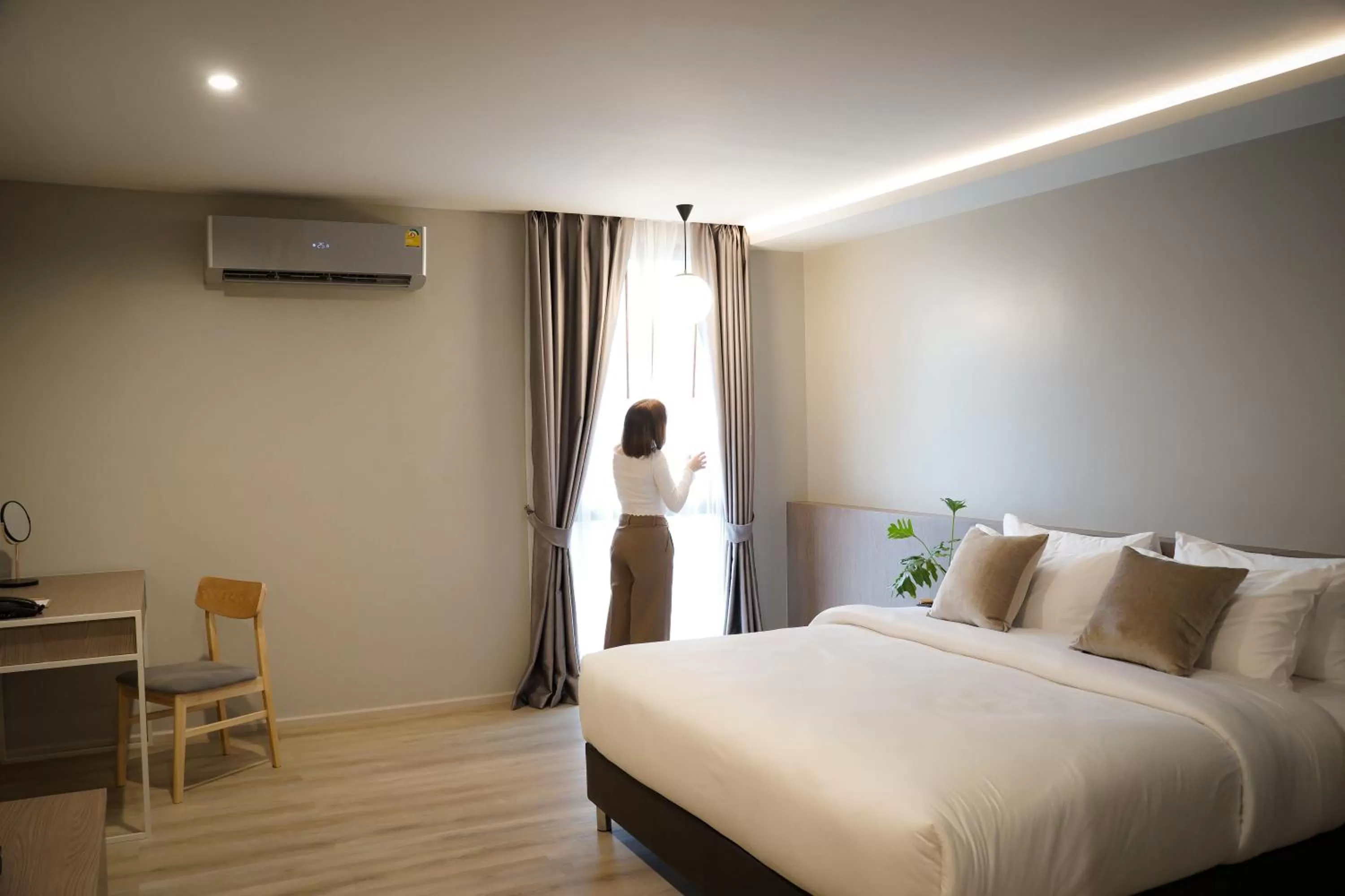 Photo of the whole room, Bed in The Rise Suites Hotel, Chiang Mai - SHA Extra Plus