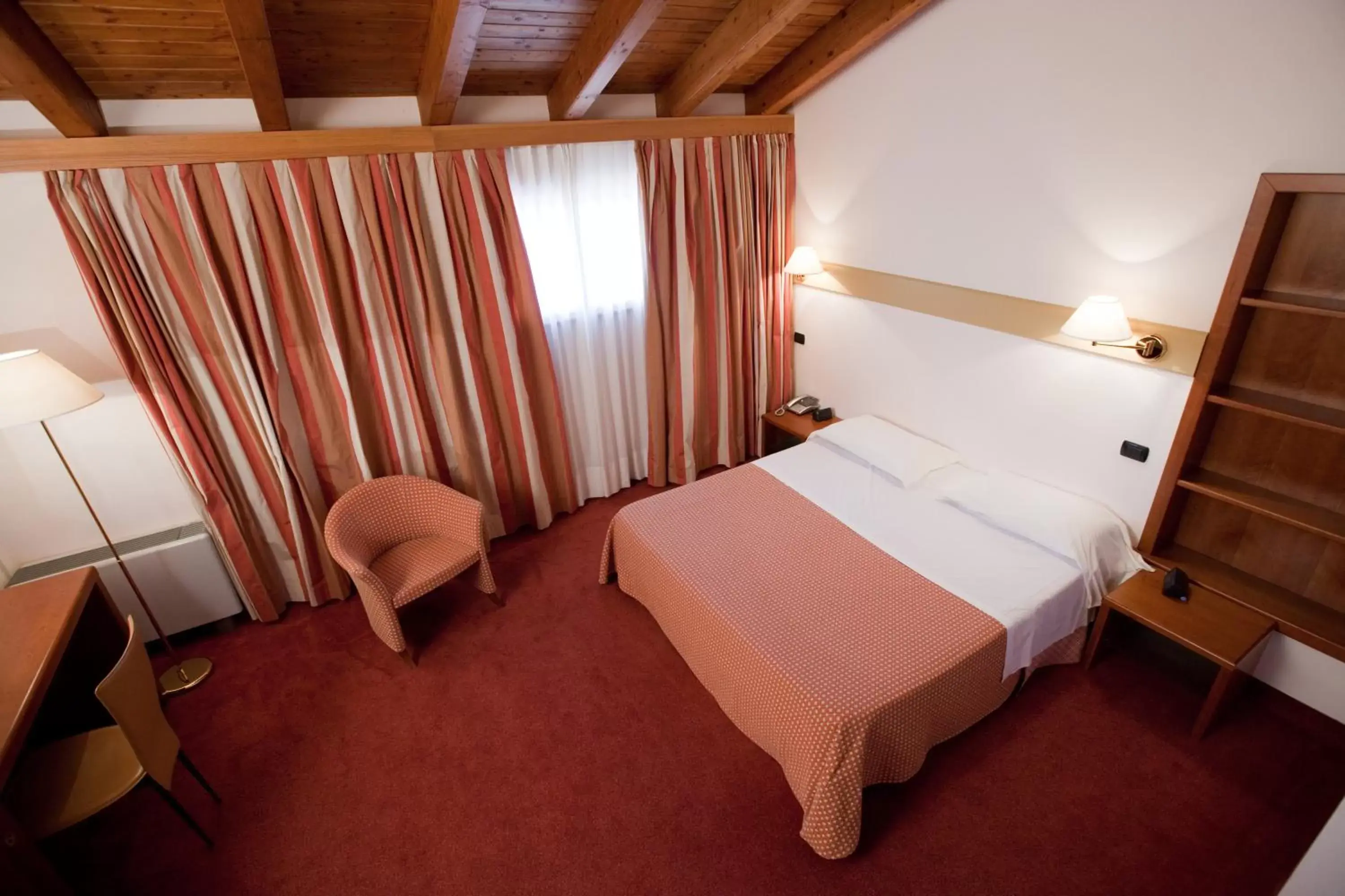 Bed in Eurohotel Palace Maniago