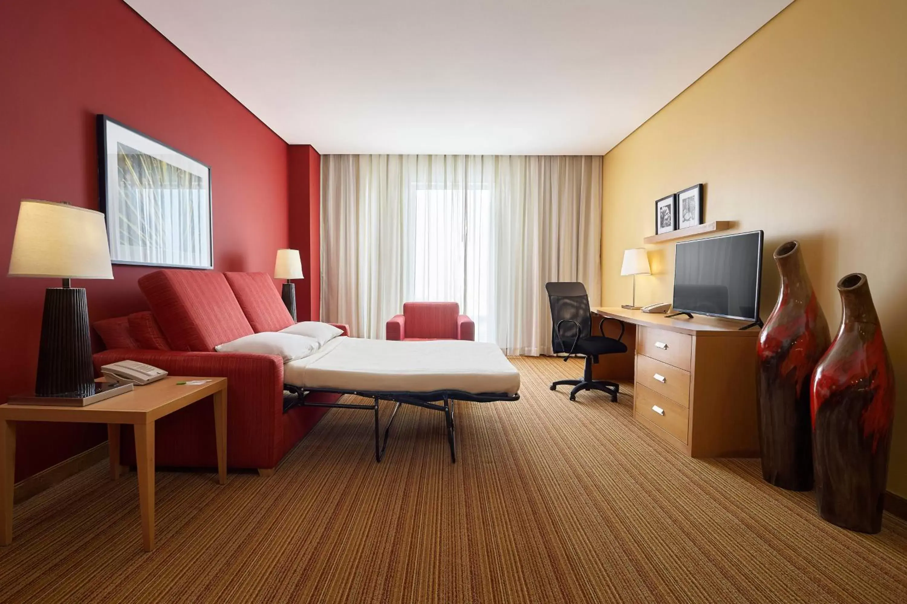 Bedroom, TV/Entertainment Center in Courtyard by Marriott Leon at The Poliforum