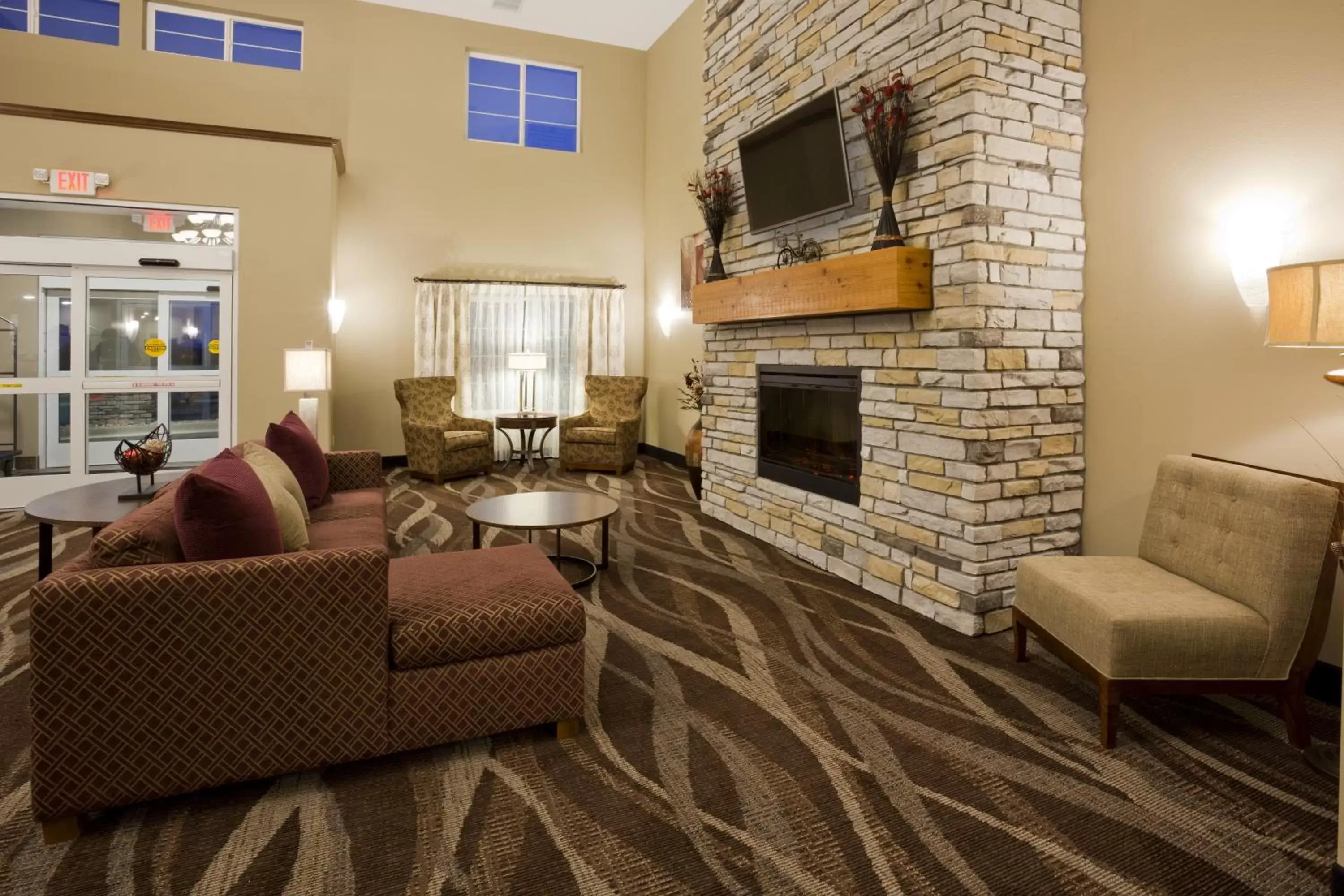 Communal lounge/ TV room, Seating Area in GrandStay Hotel and Suites - Tea/Sioux Falls