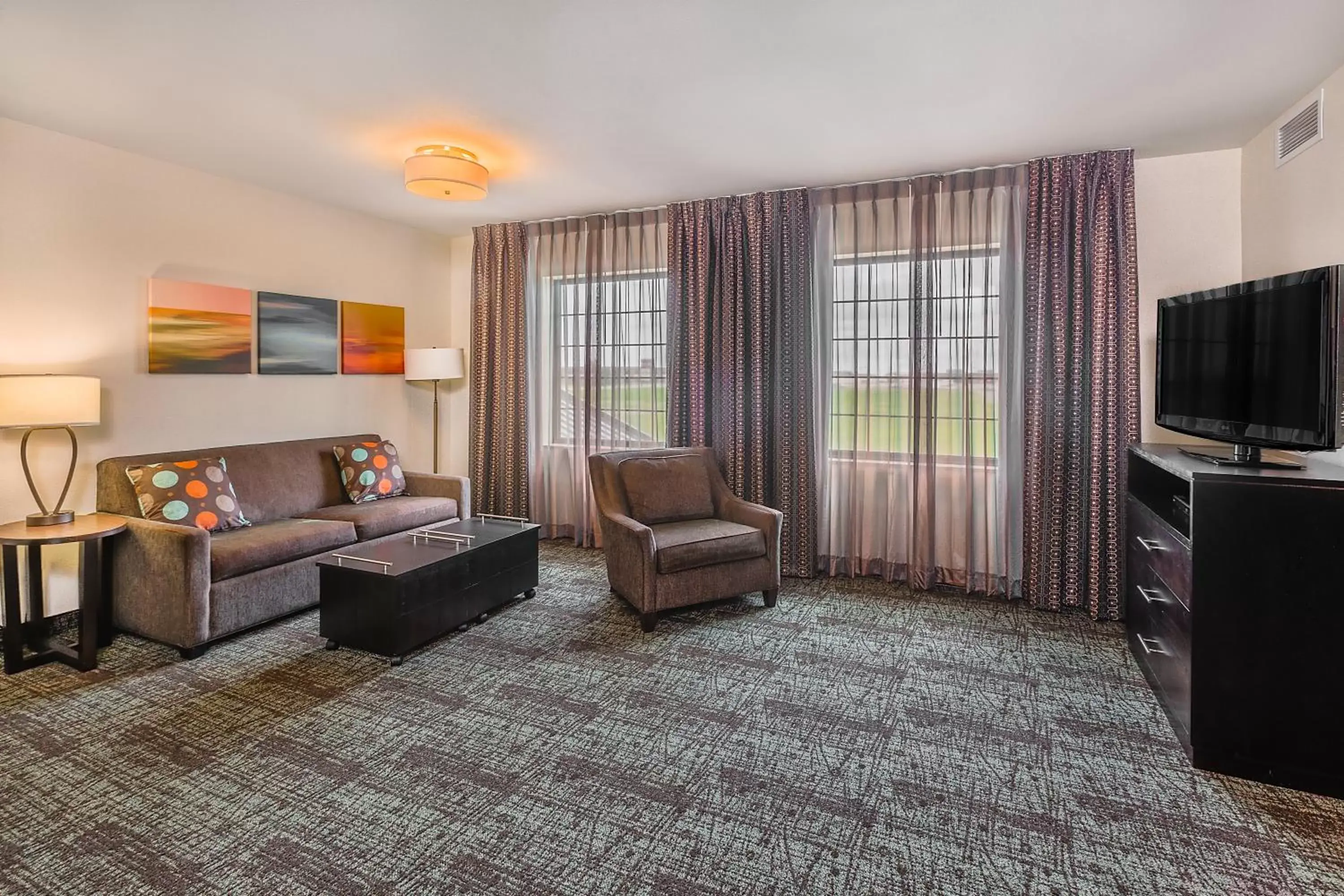 Photo of the whole room, Seating Area in Staybridge Suites Bismarck, an IHG Hotel