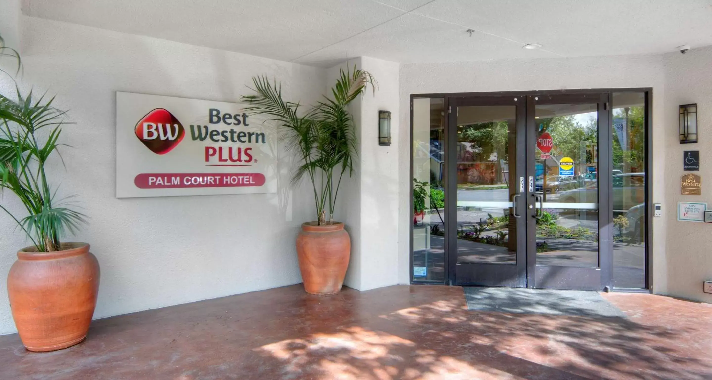 Property building in Best Western Plus Palm Court Hotel