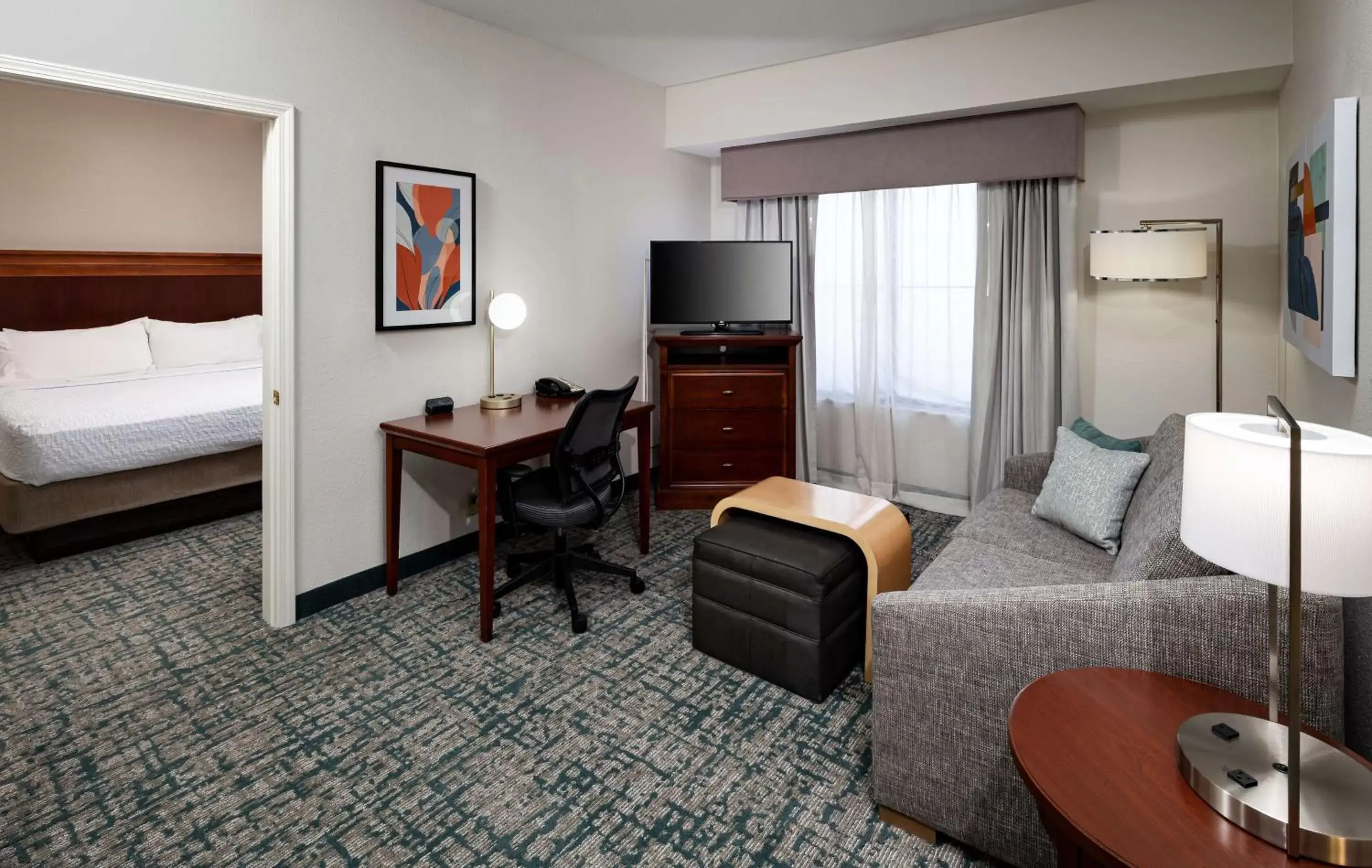 Living room, TV/Entertainment Center in Homewood Suites by Hilton Jacksonville-South/St. Johns Ctr.