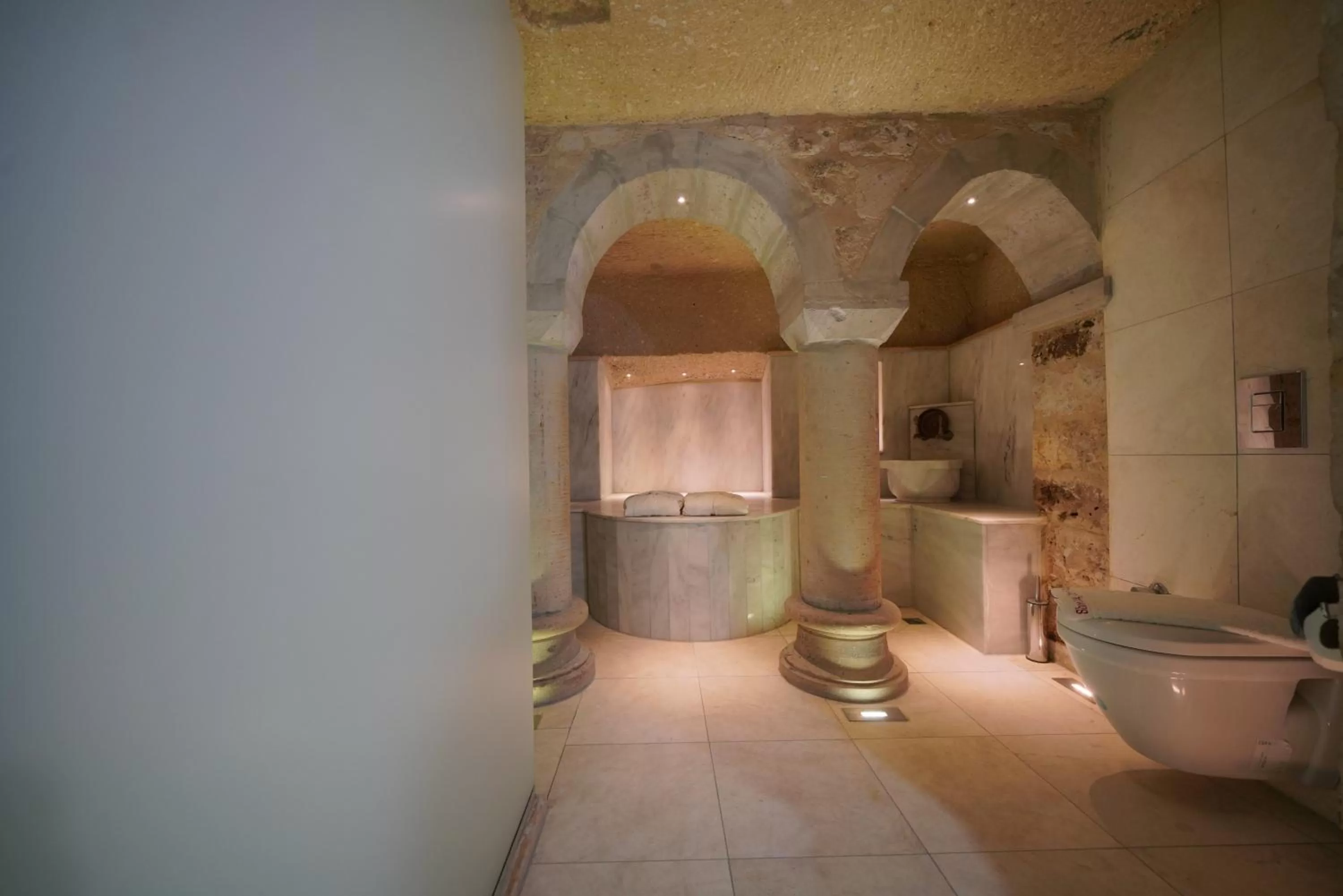 Public Bath in Shoestring Cave House