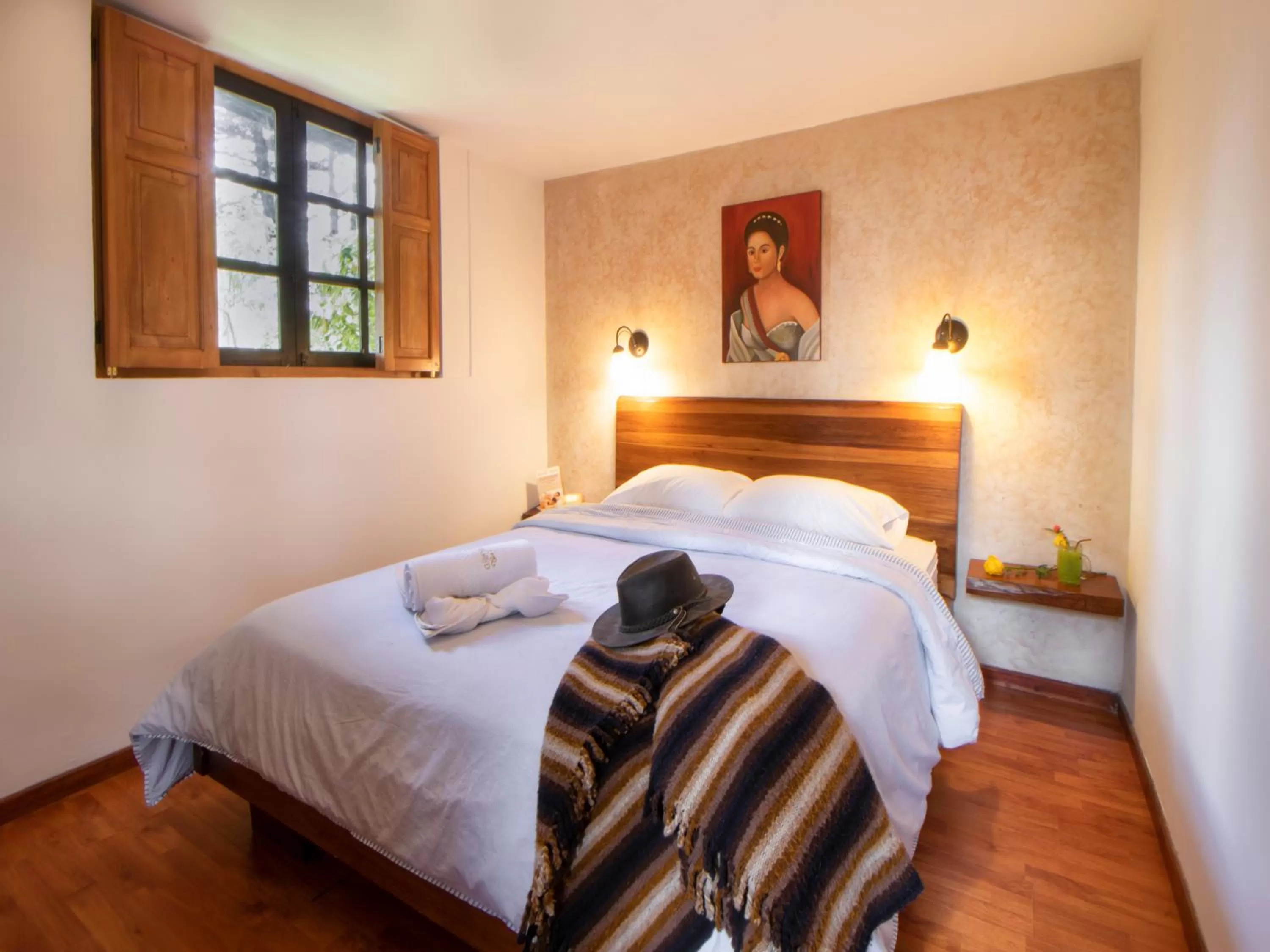 Bed in Hosteria Papagayo Cotopaxi