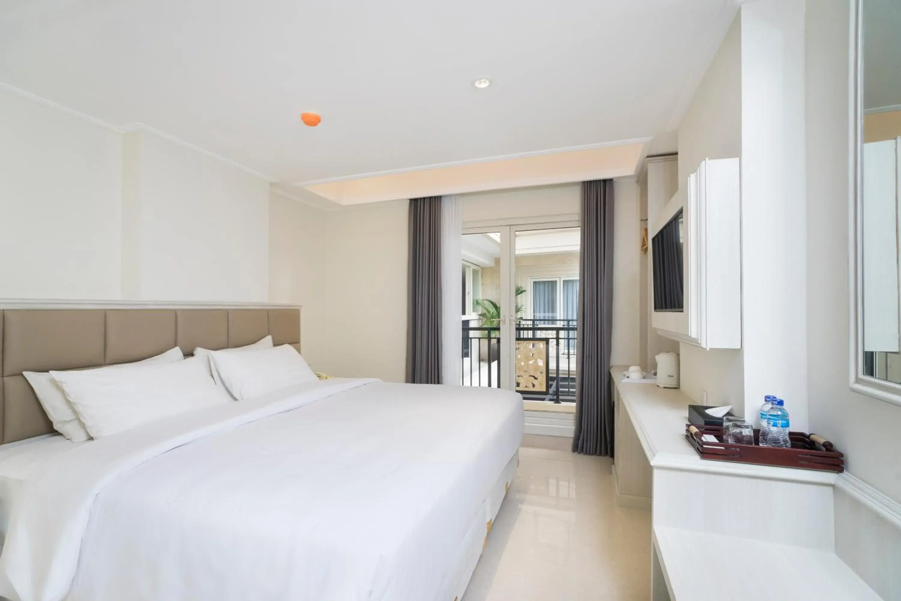 Bed in Alron Hotel Kuta Powered by Archipelago