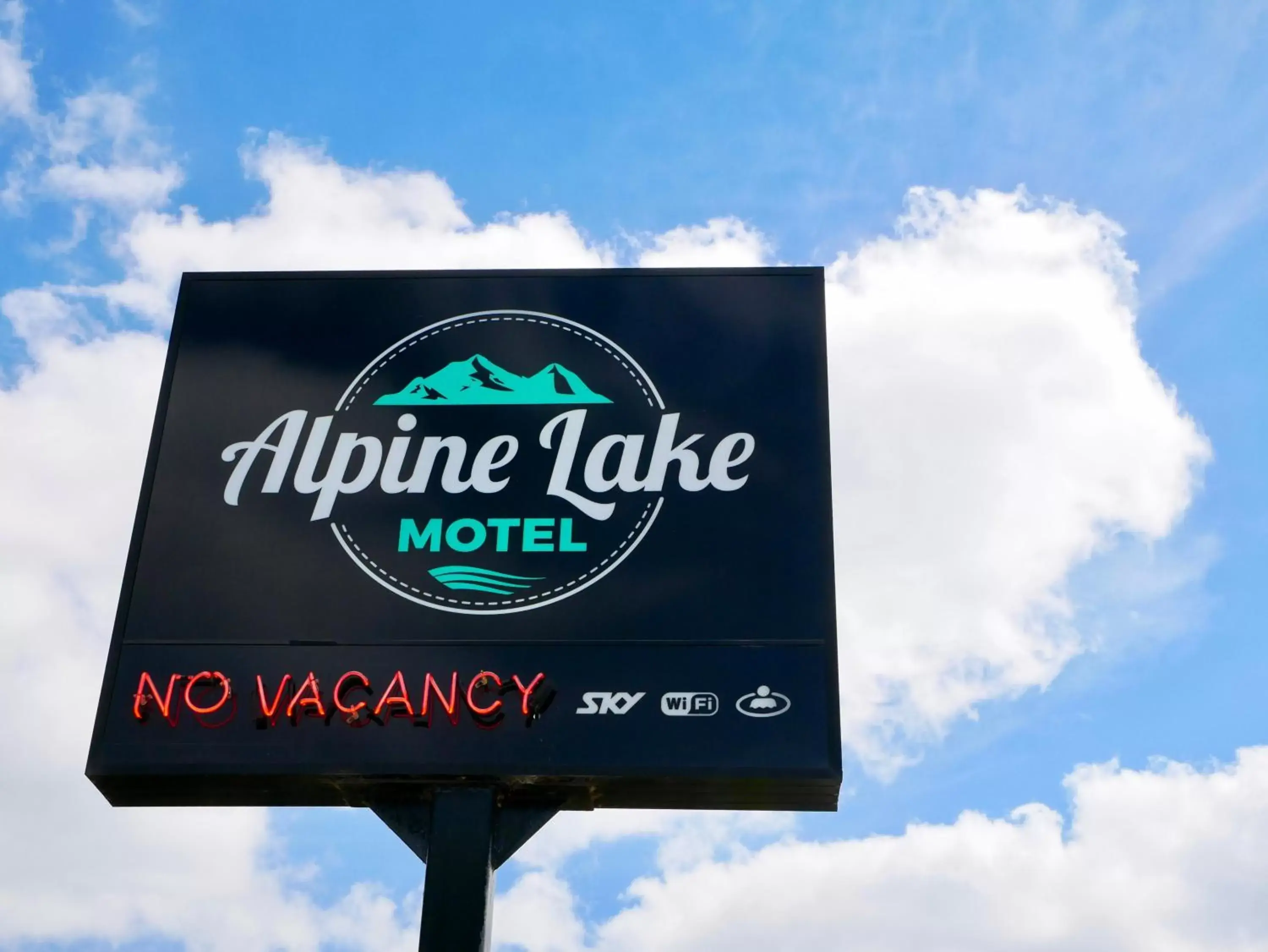 Property logo or sign in Alpine Lake Motel