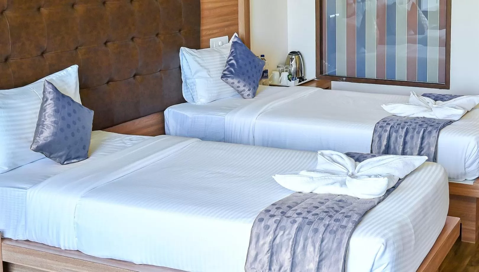 Bed in Hotel Laxmi Empire