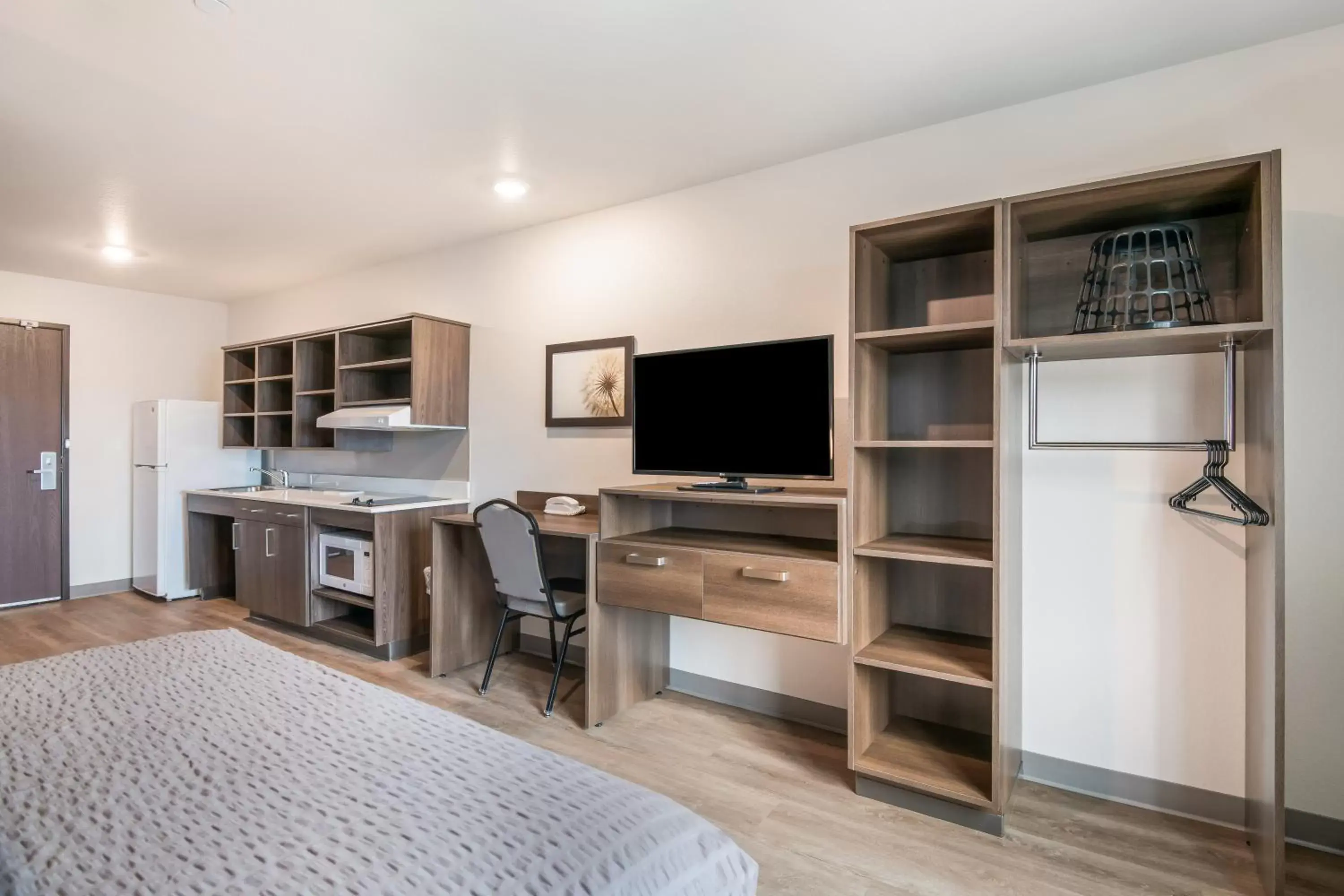 Photo of the whole room, TV/Entertainment Center in WoodSpring Suites Broomfield-Westminster