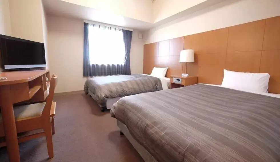 Bed in Hotel Route-Inn Shinjyo Ekimae