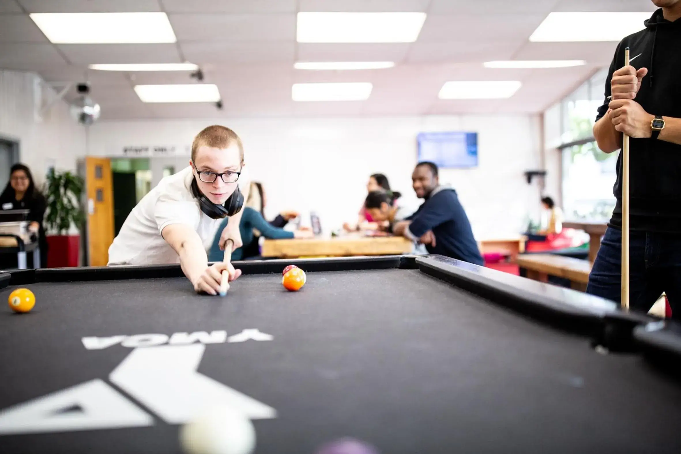 Communal lounge/ TV room, Billiards in YMCA Hostel