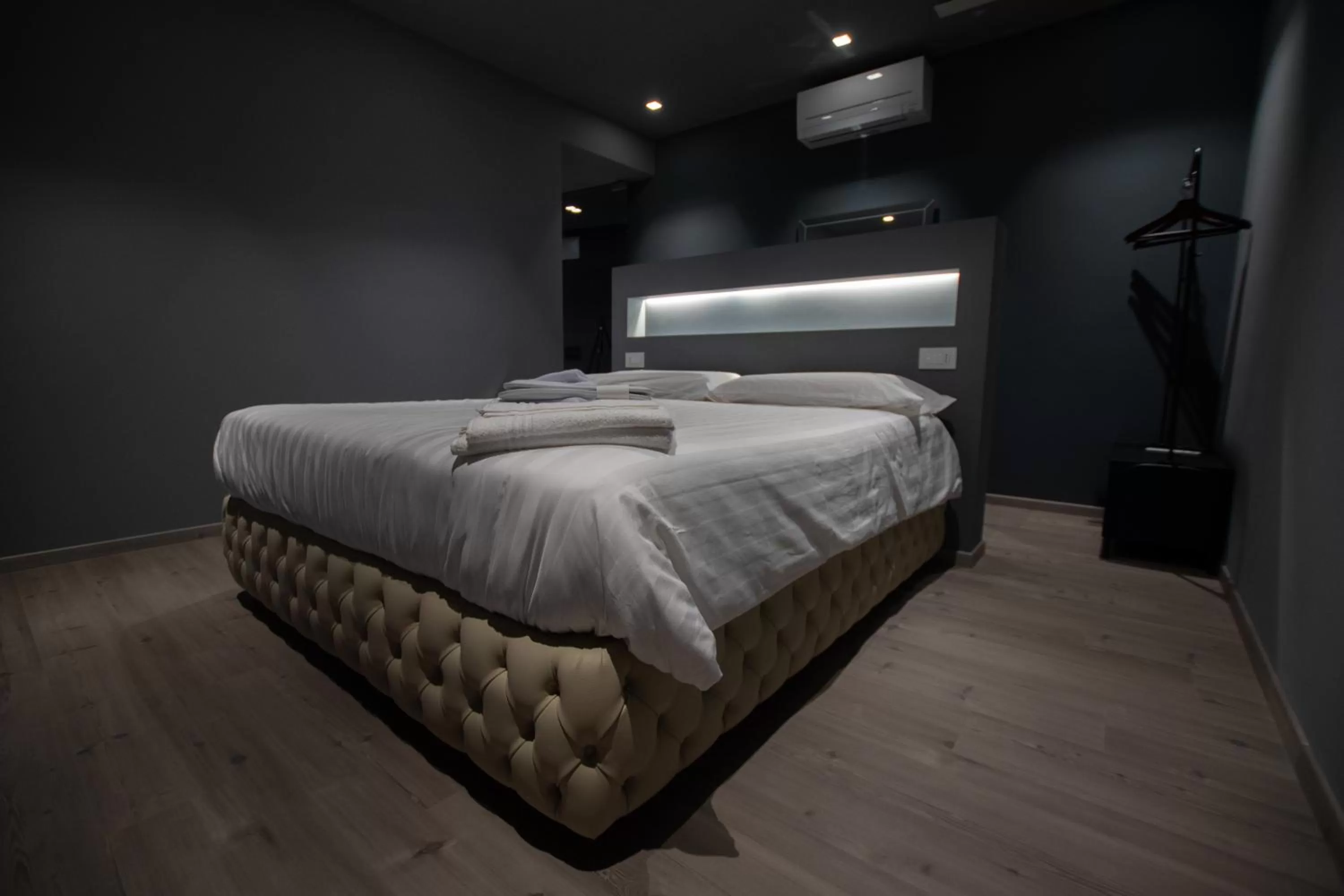 Bed in DiVino Rooms Deluxe