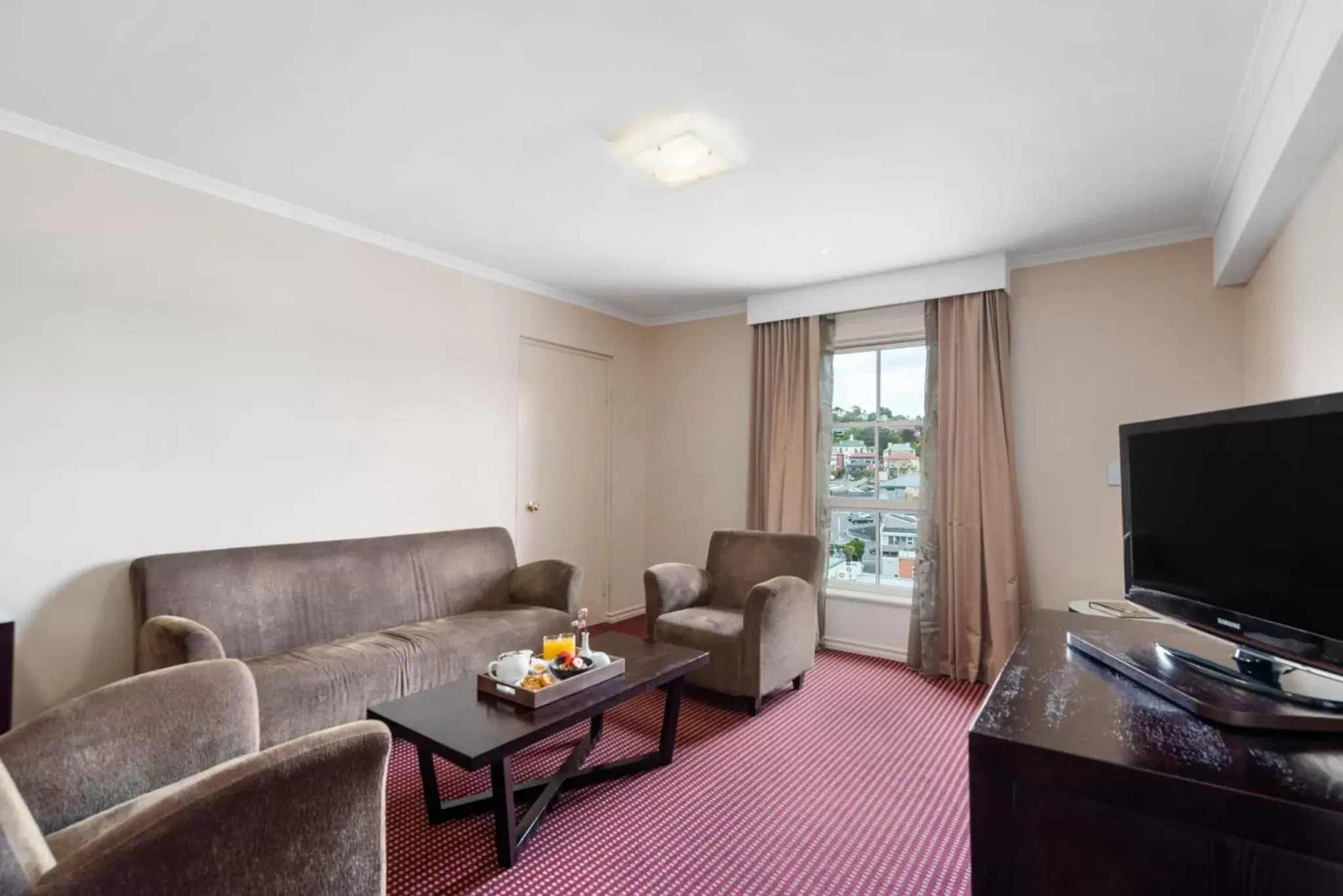 Living room, Seating Area in Hotel Grand Chancellor Launceston