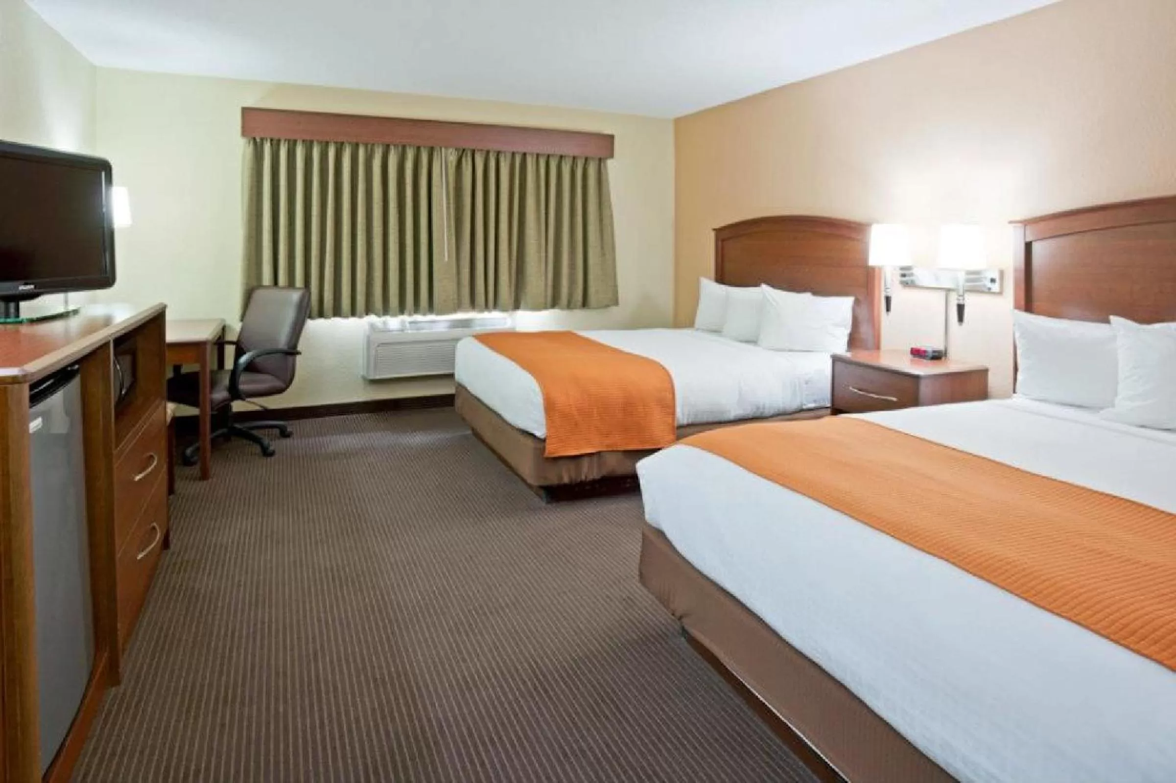 Bed in AmericInn by Wyndham Fargo West Acres