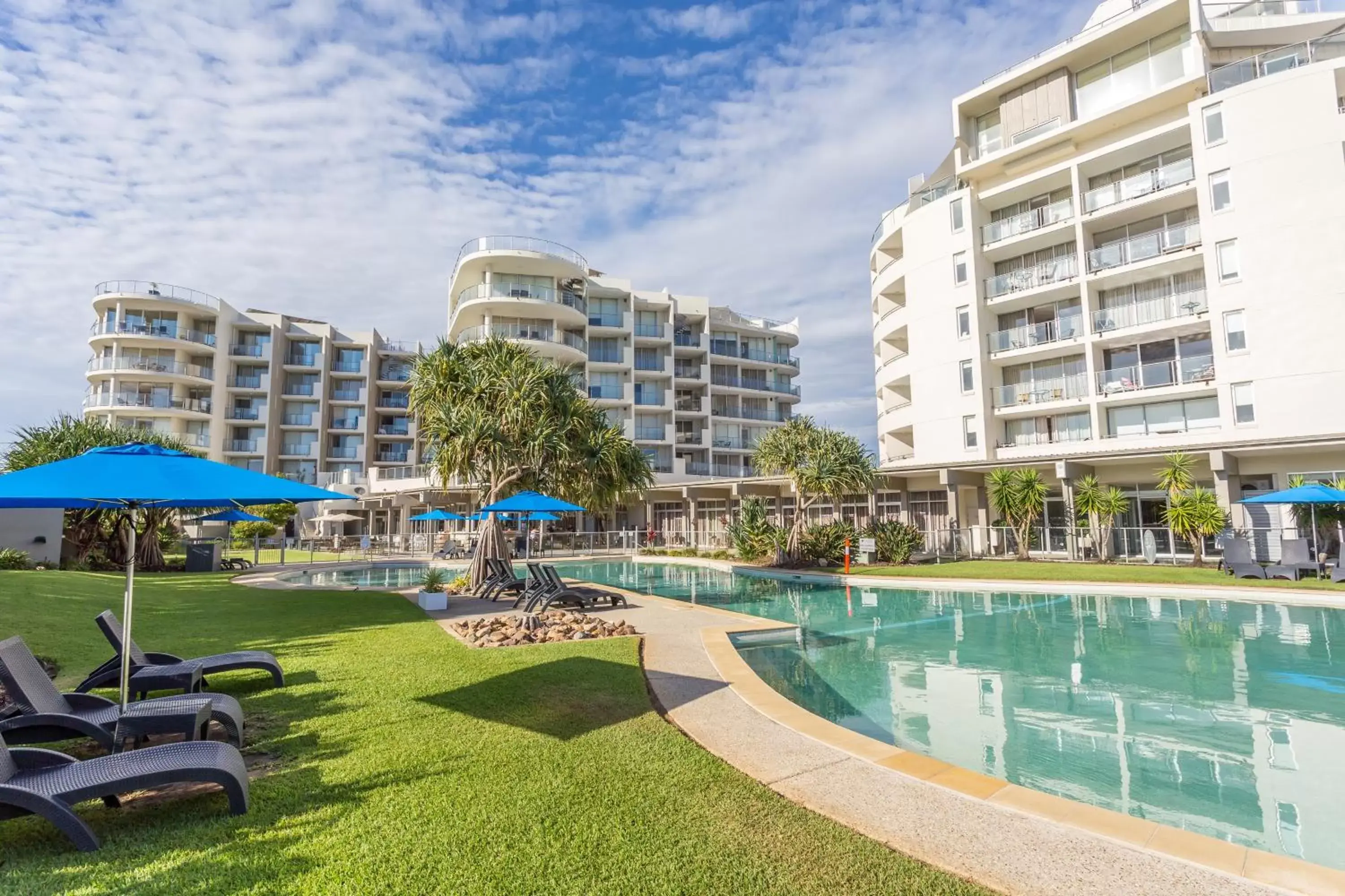 Swimming pool, Property Building in Ramada By Wyndham Marcoola Beach