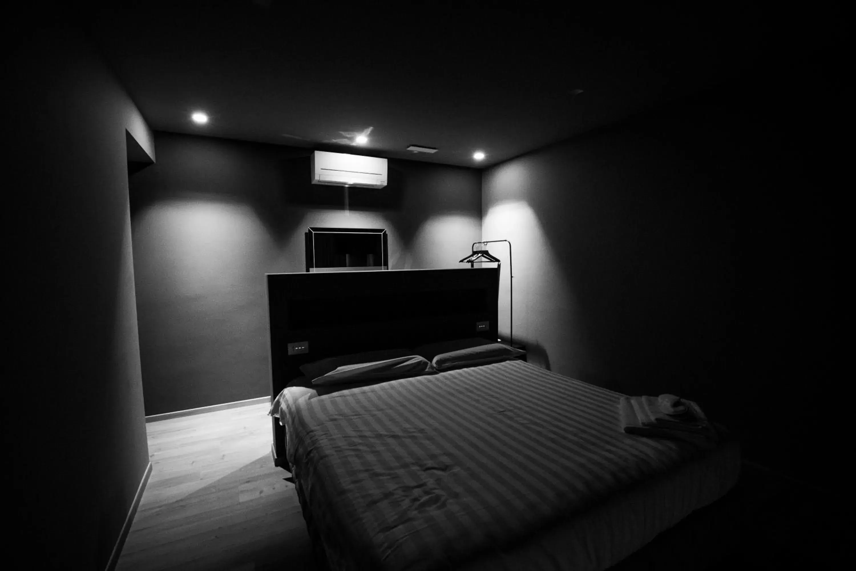 Bed in DiVino Rooms Deluxe
