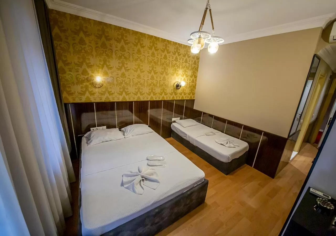 Bed in Royal Palace Hotel