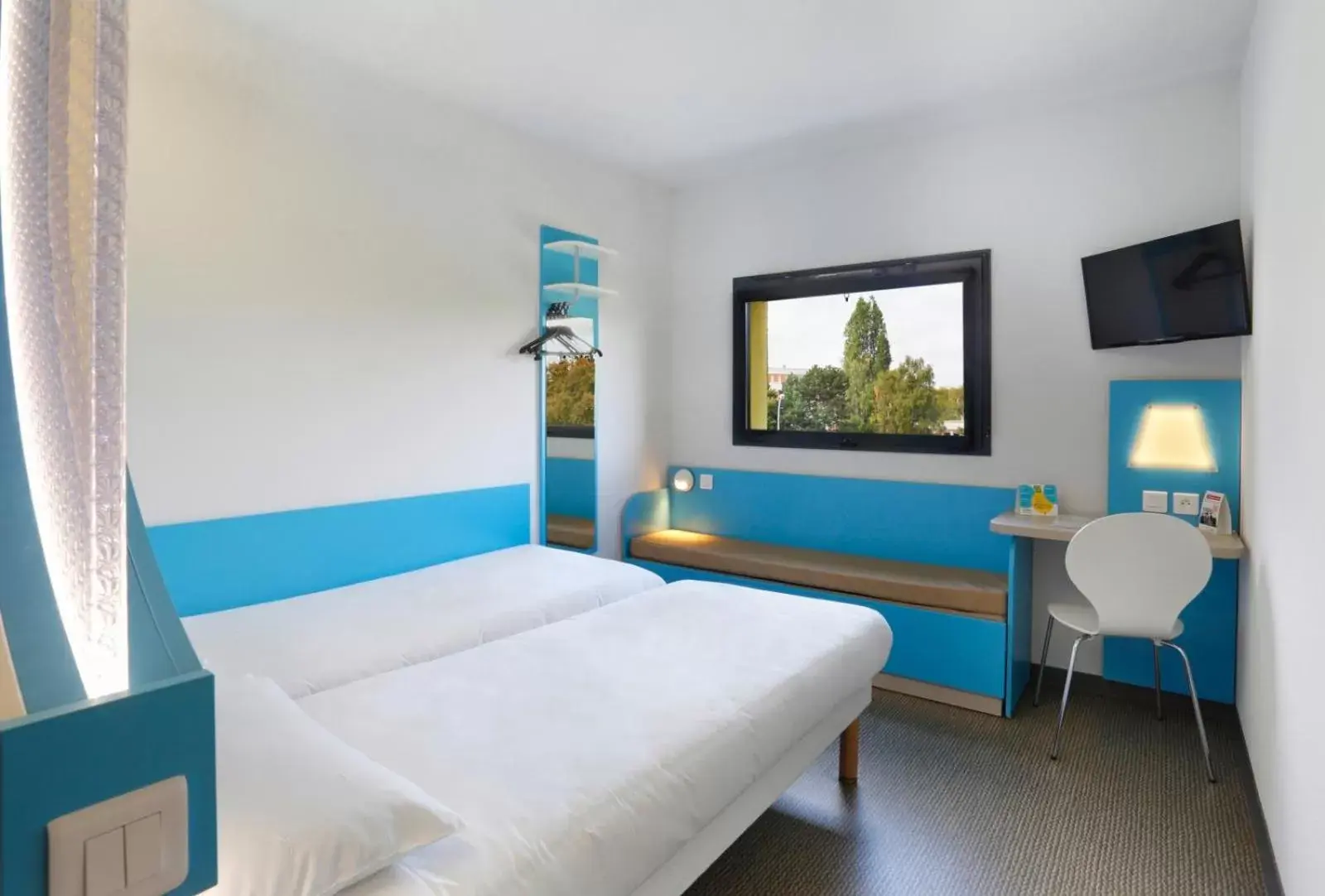 Bed in First Inn Hotel Blois