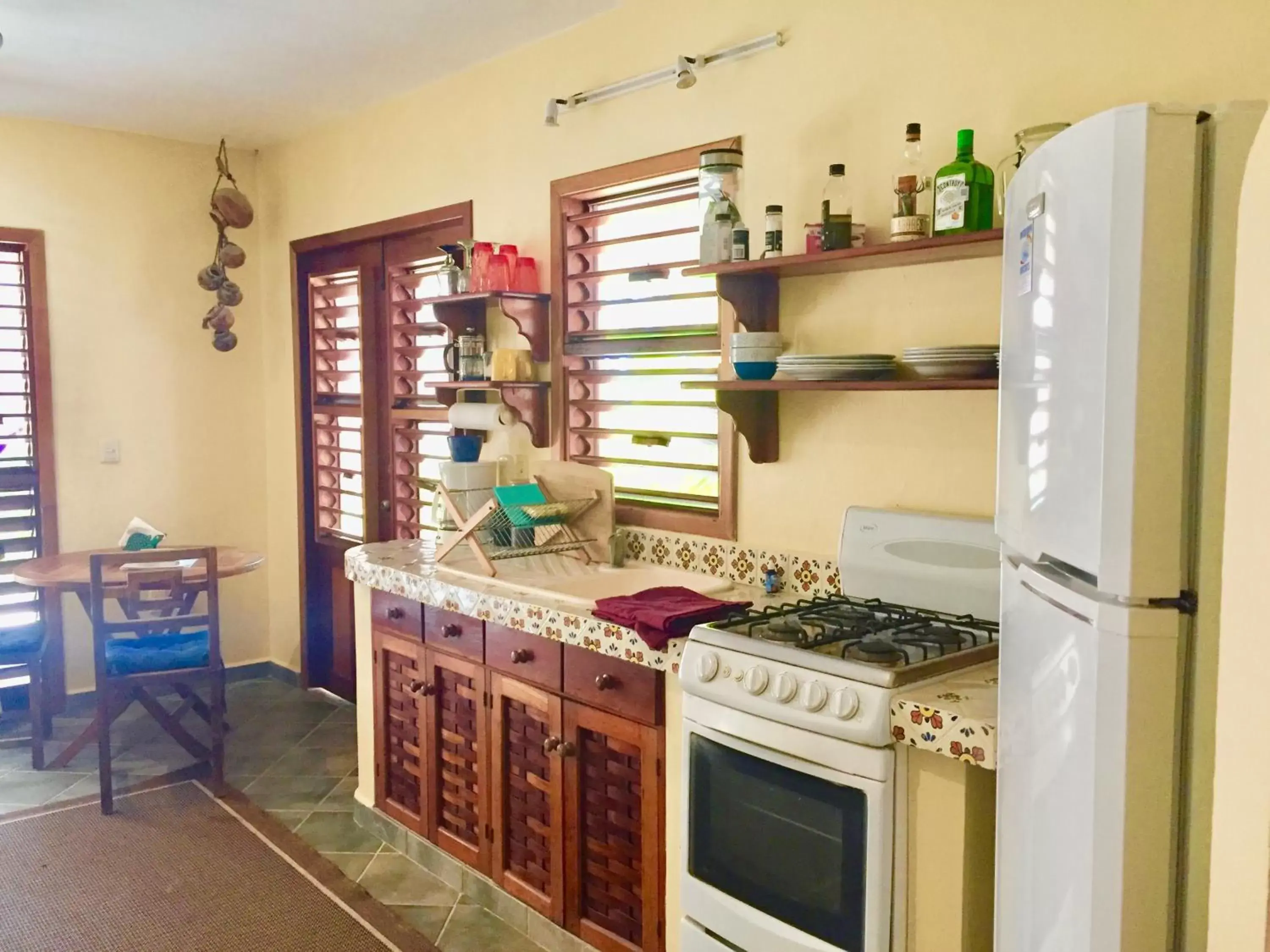 Kitchen/Kitchenette in Nah Uxibal Villa and Casitas