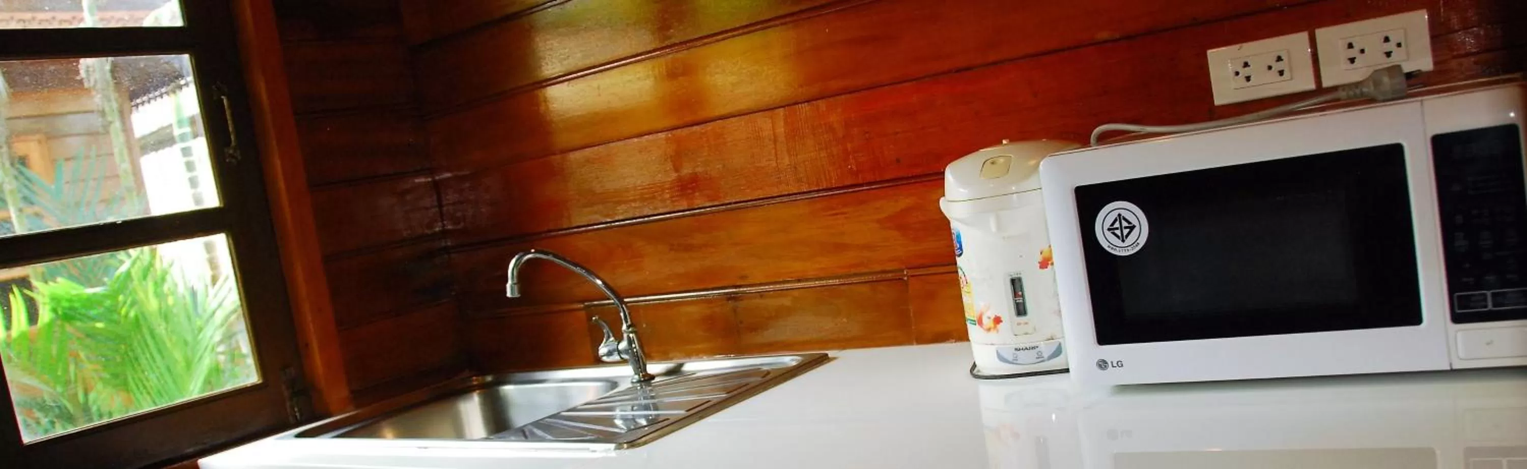 Kitchen or kitchenette in Cozy Garden Resort