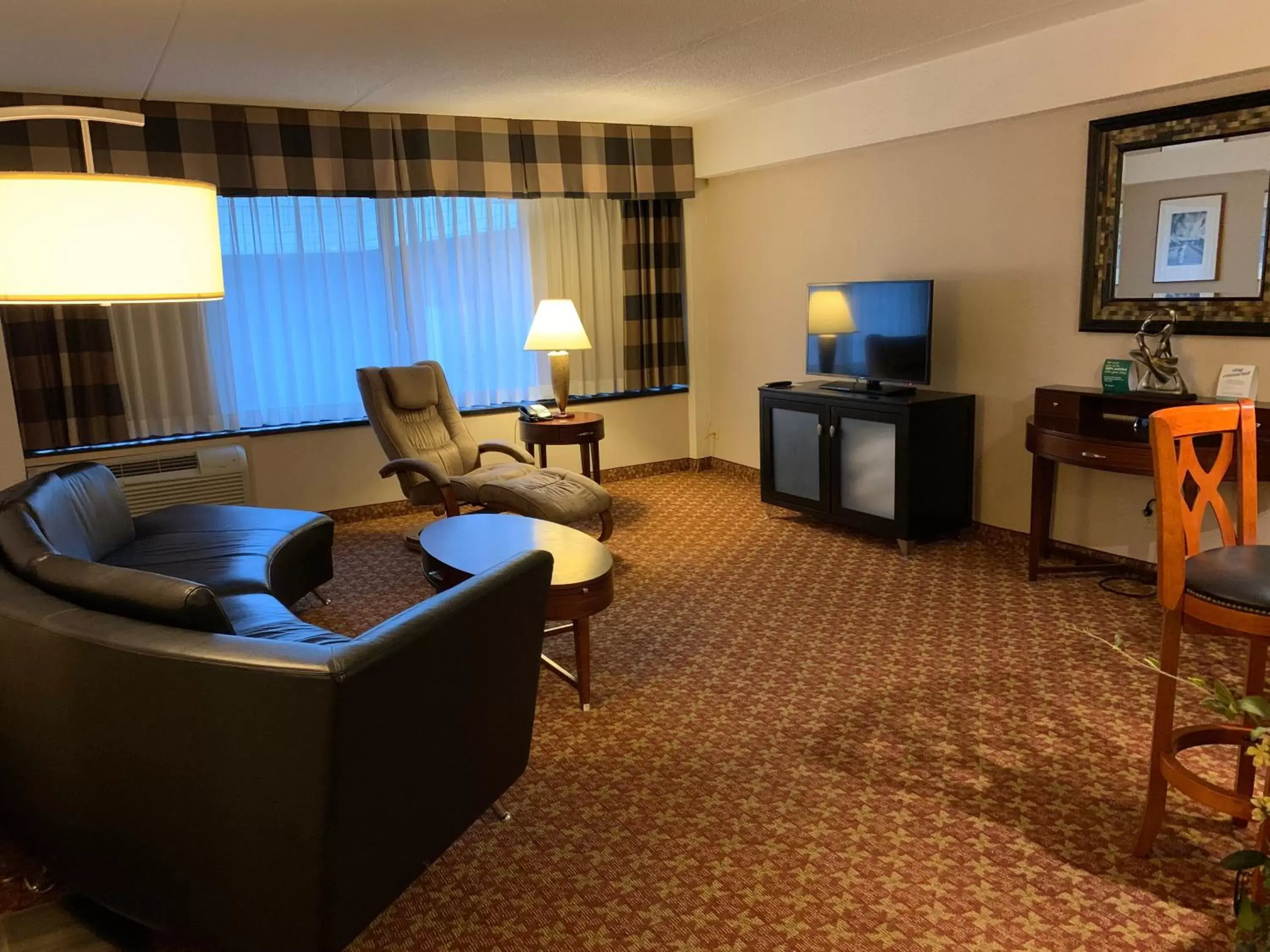 Bedroom, Seating Area in Holiday Inn Johnstown-Downtown, an IHG Hotel