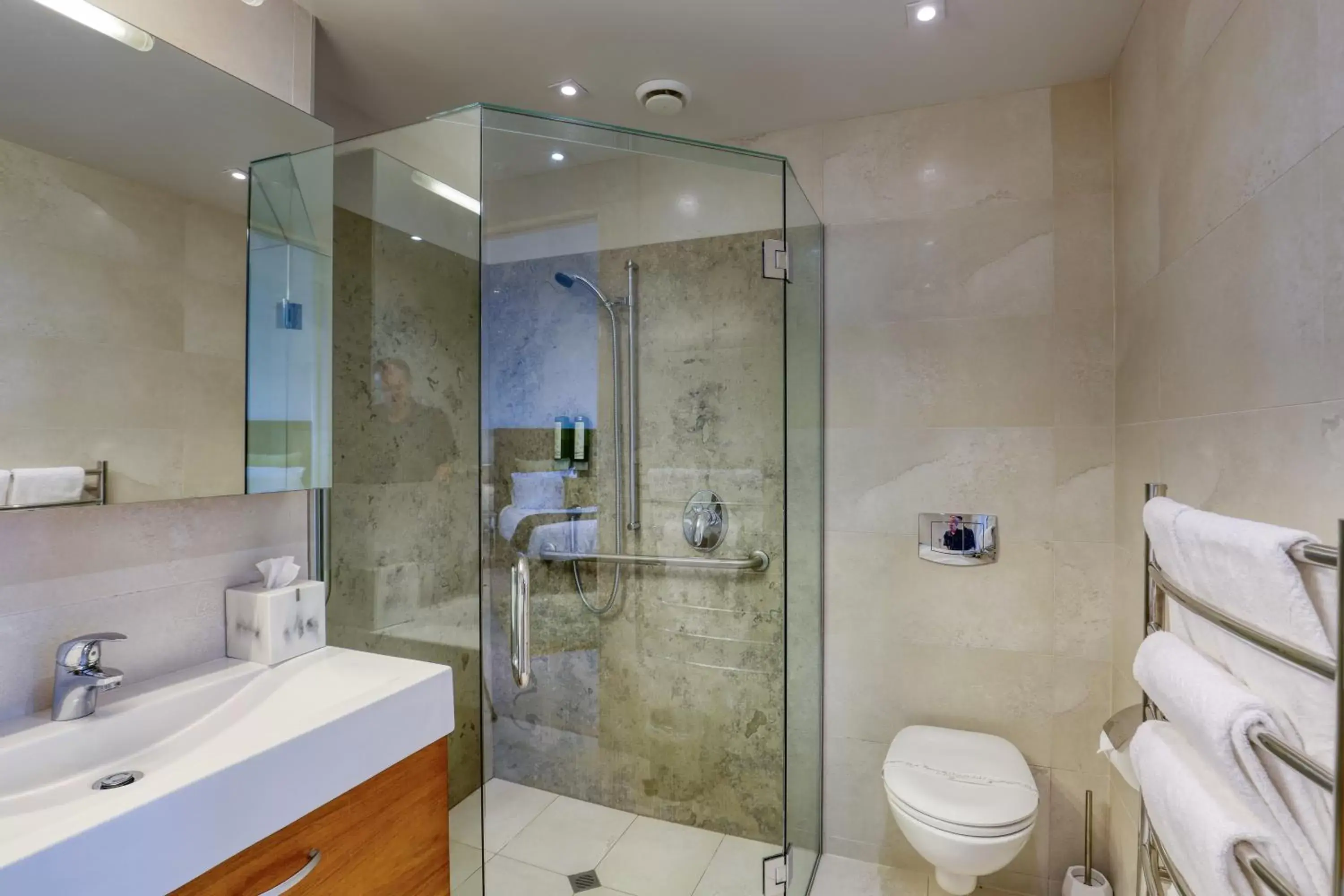 Bathroom in Ramada Suites by Wyndham Nautilus Orewa