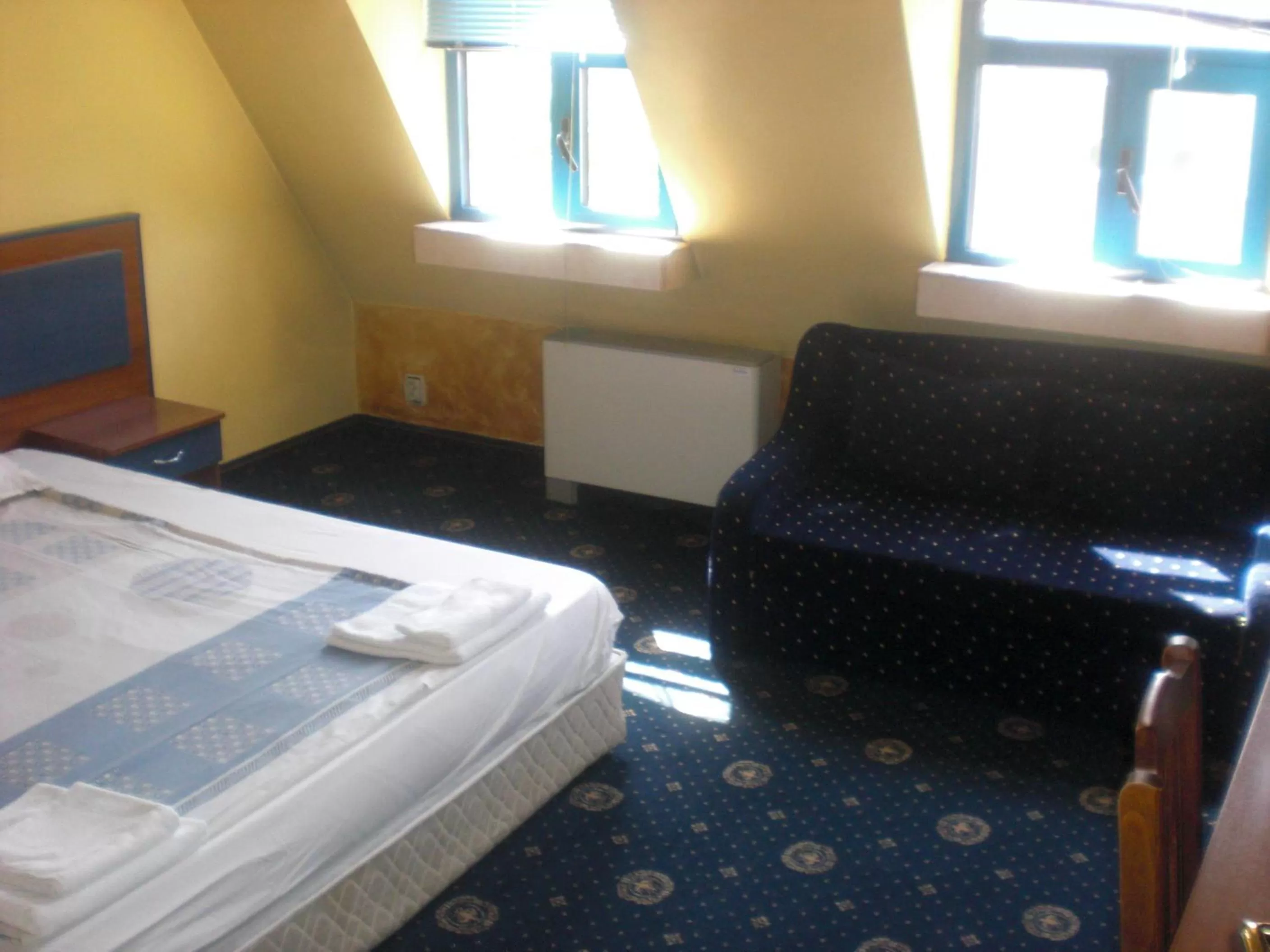 Bed in Fenix Family Hotel