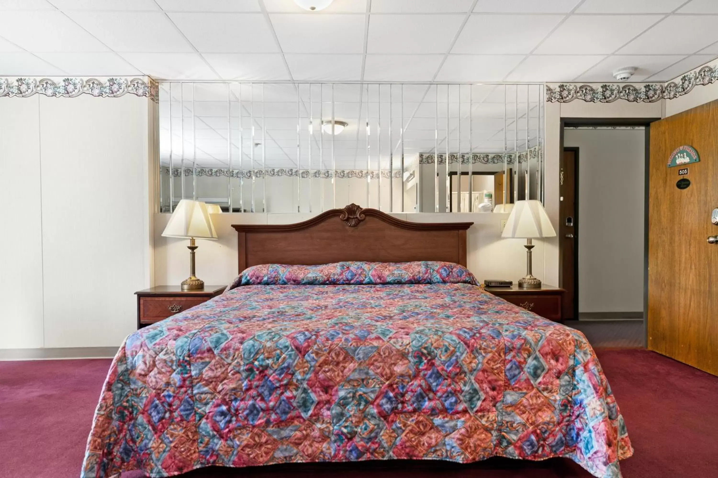Bed in Candlewick Inn and Suites